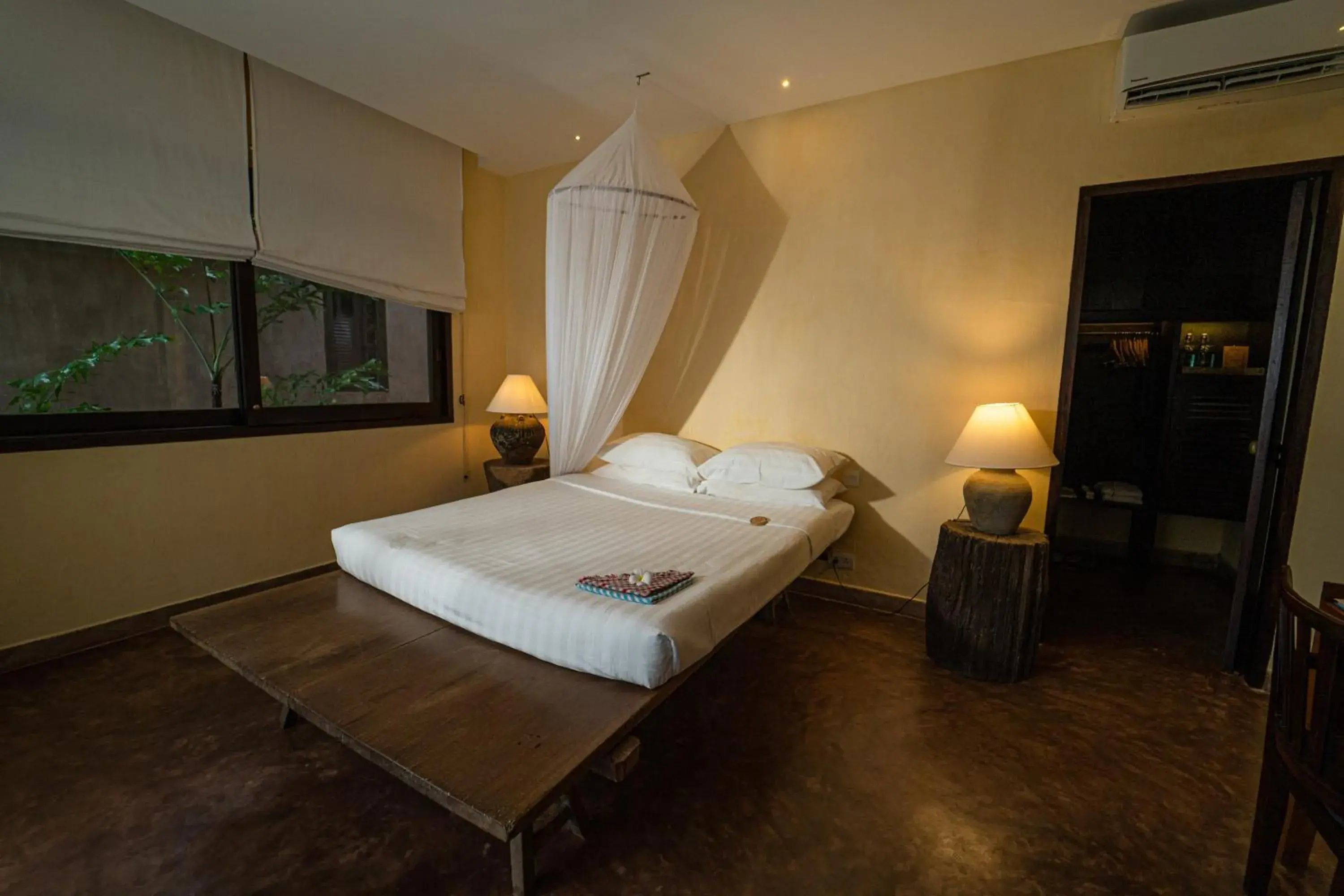 Bed in Knai Bang Chatt Resort