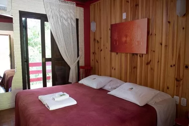Bed in Pousada da Chacara