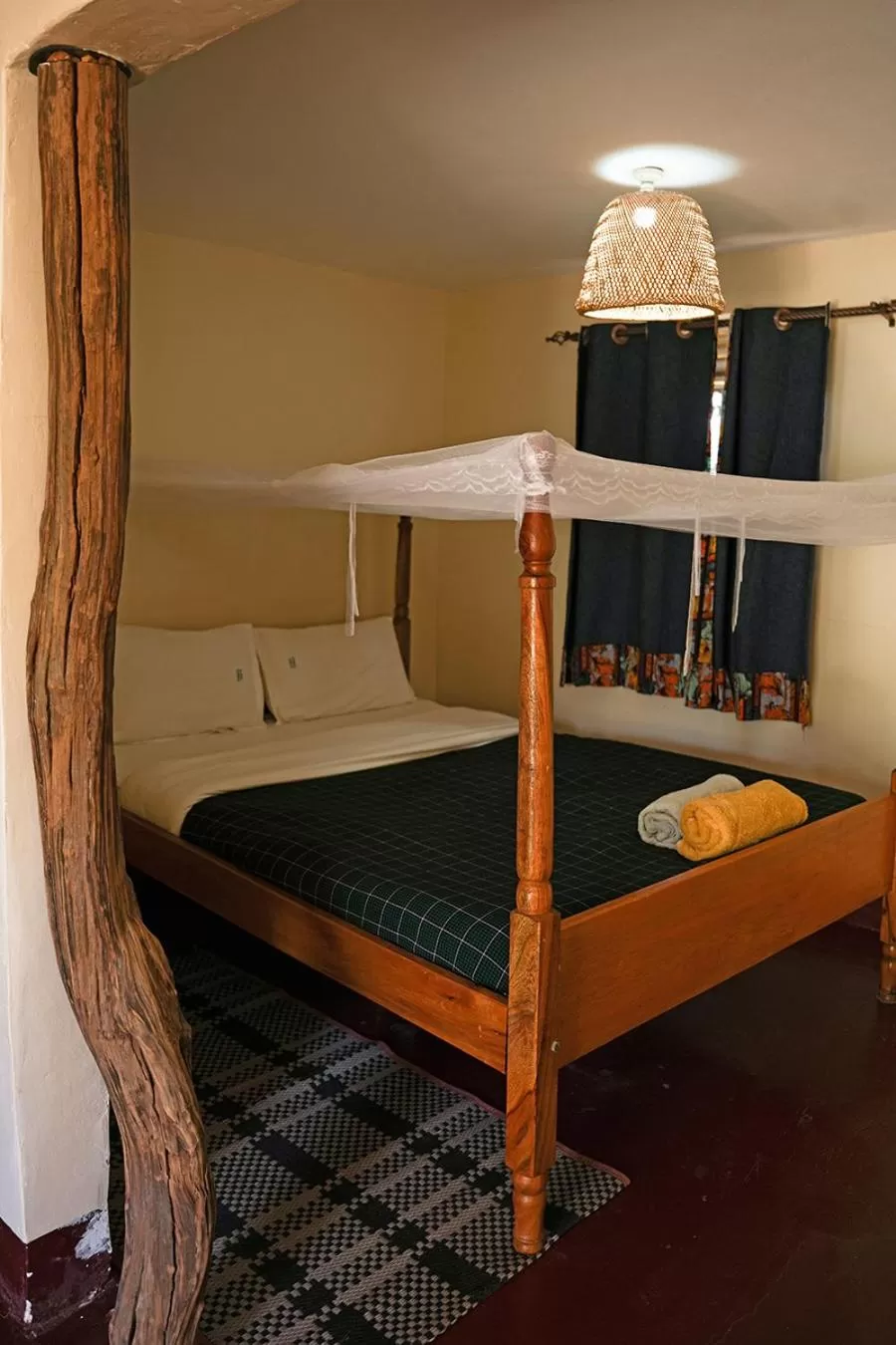 Bed in Kara-Tunga Safari Camp