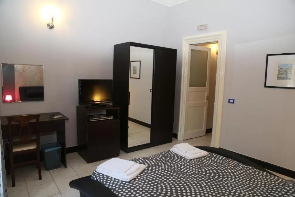 Photo of the whole room, Bed in Hotel Sangiuliano 132 centro storico Catania