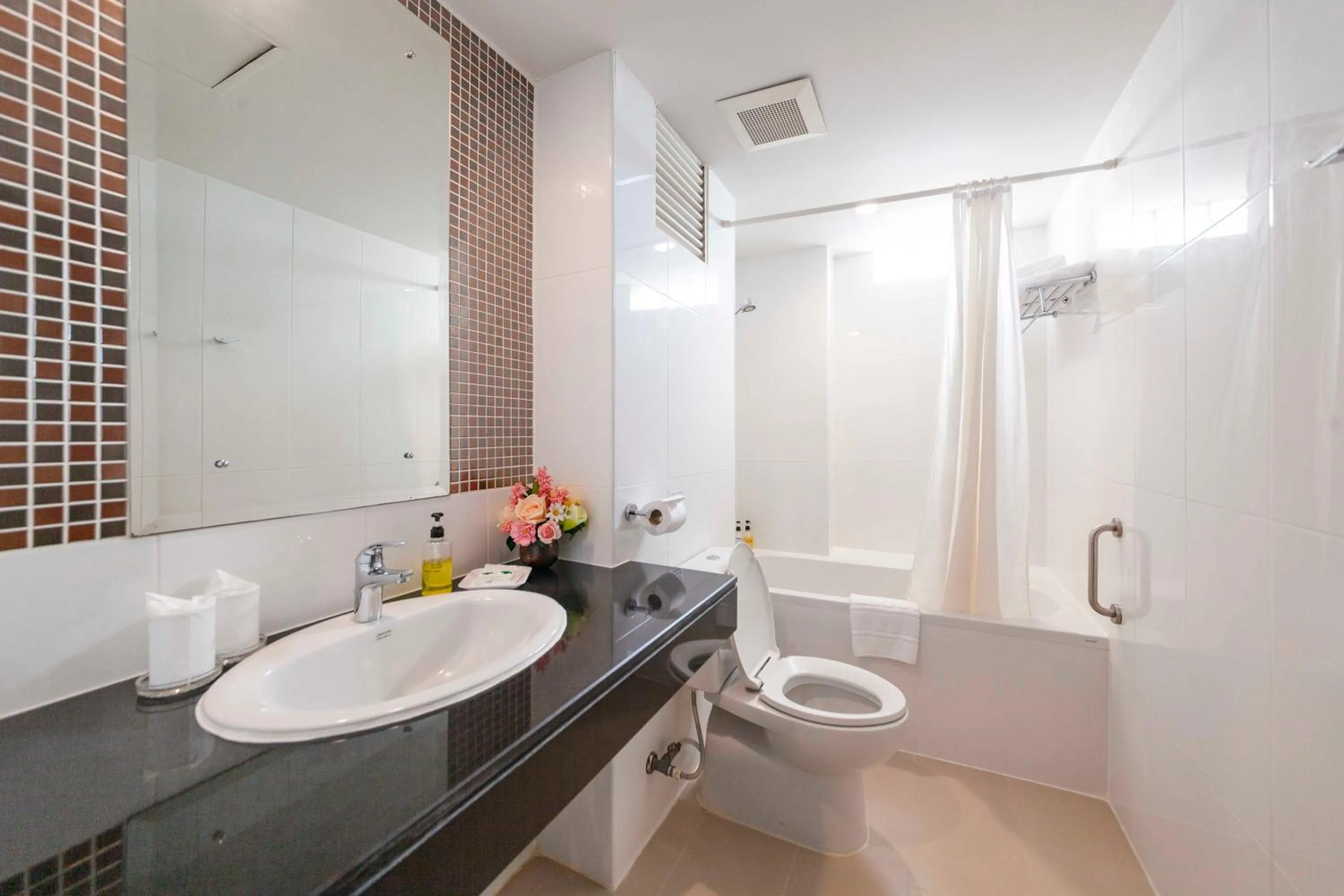 Toilet in Holiday Garden Hotel & Resort SHA EXTRA PLUS