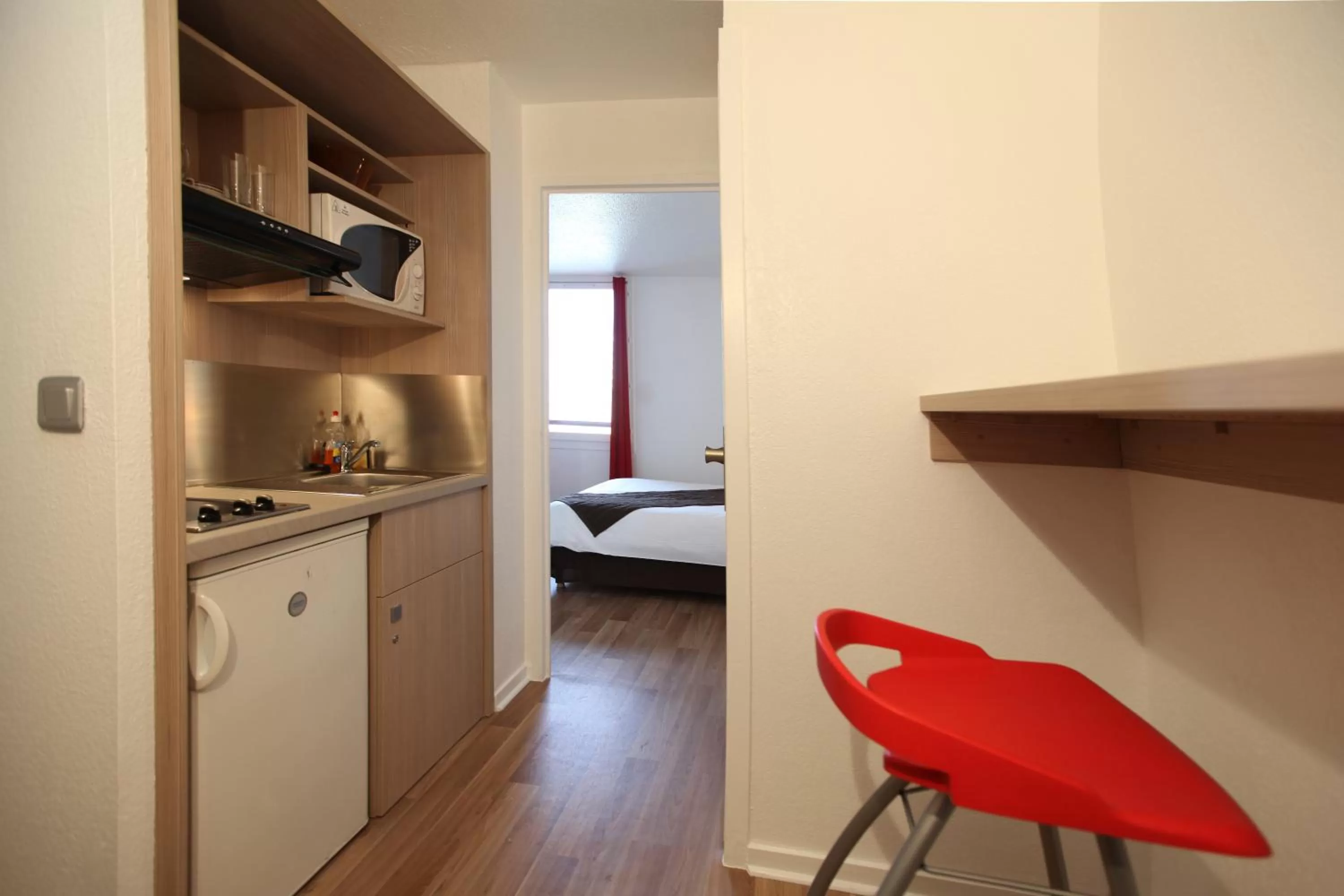 Kitchen or kitchenette, Bed in Geneva Residence