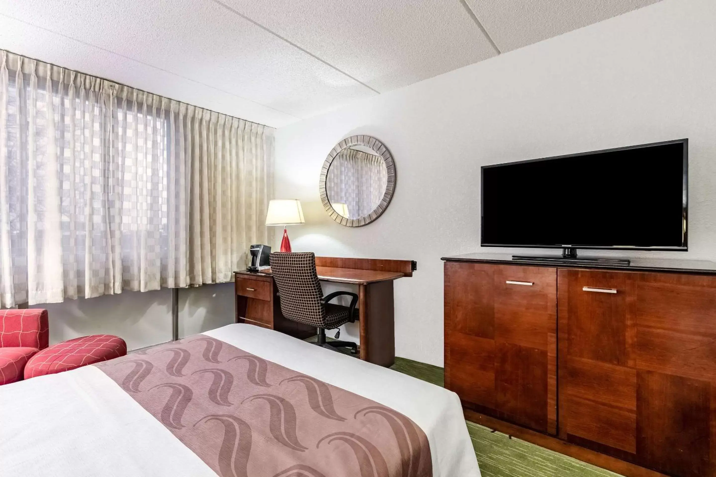 Photo of the whole room, TV/Entertainment Center in Quality Inn & Suites