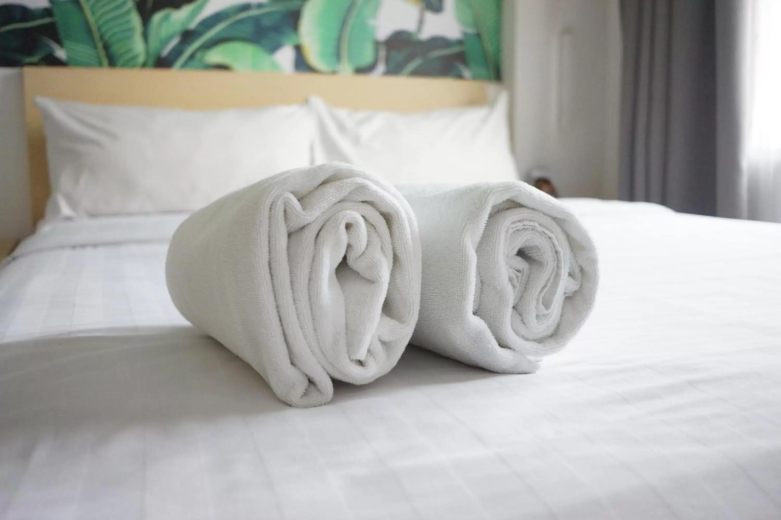 towels, Bed in Liberta Hotel Kemang