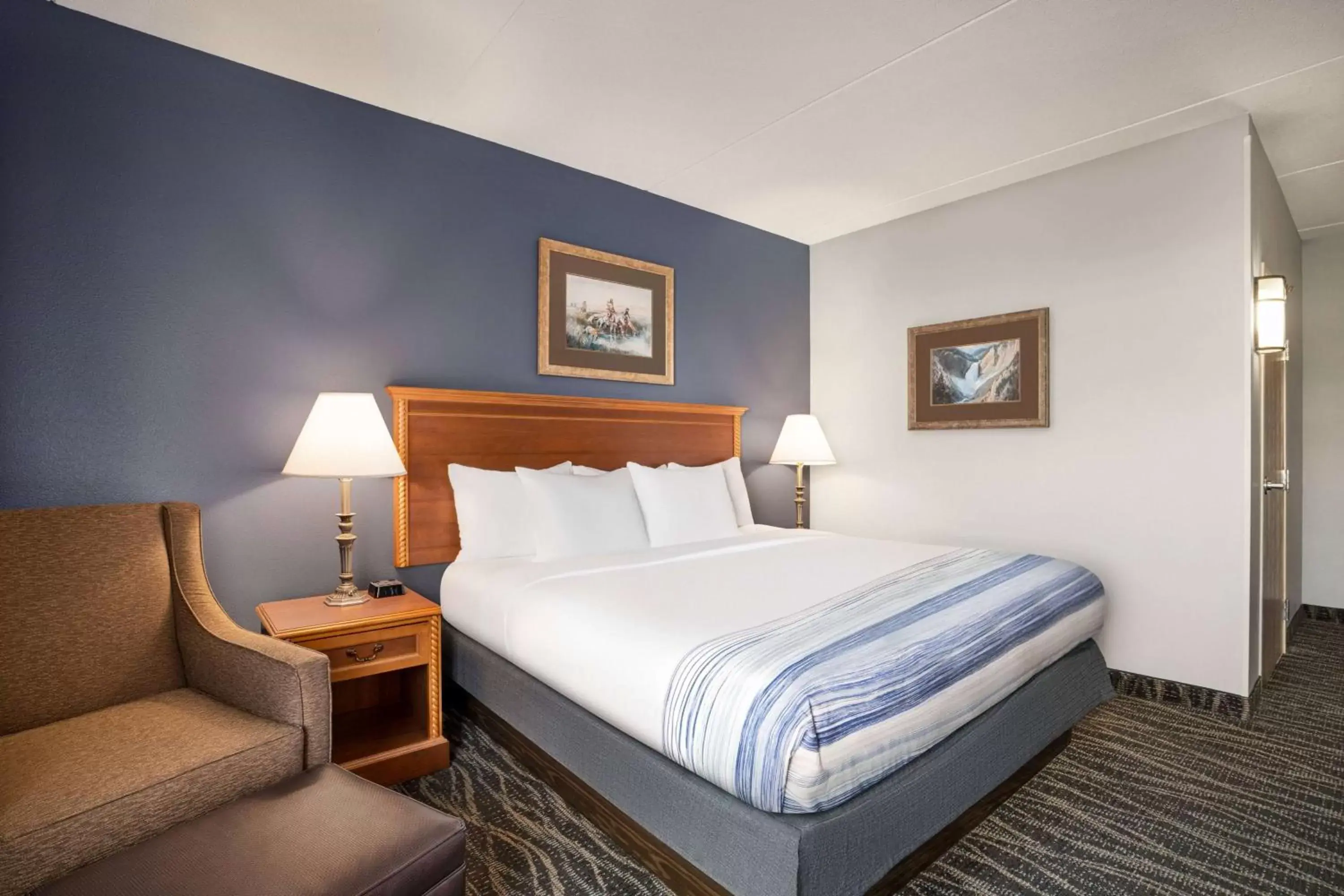 Photo of the whole room, Bed in AmericInn by Wyndham Laramie Near University of Wyoming