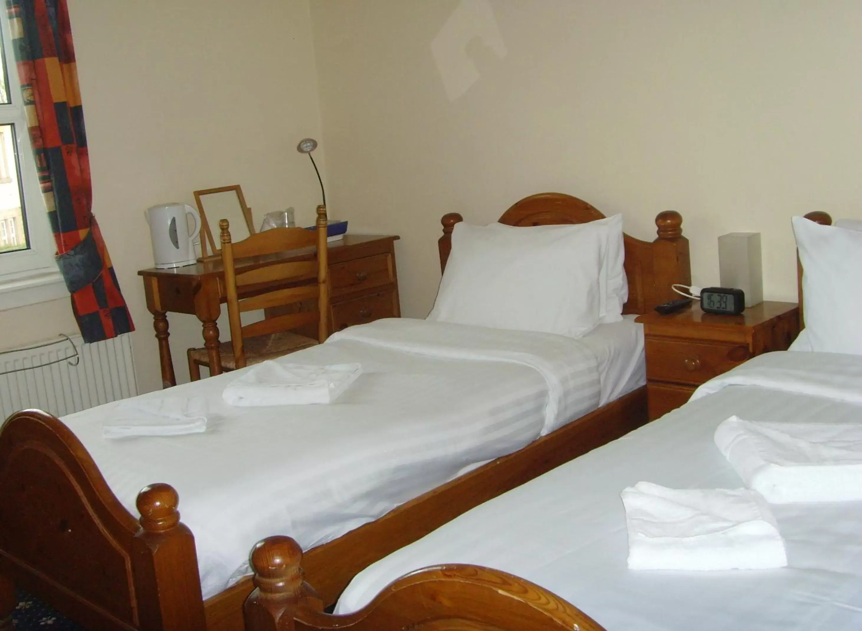 Bed in Twin Lions Hotel