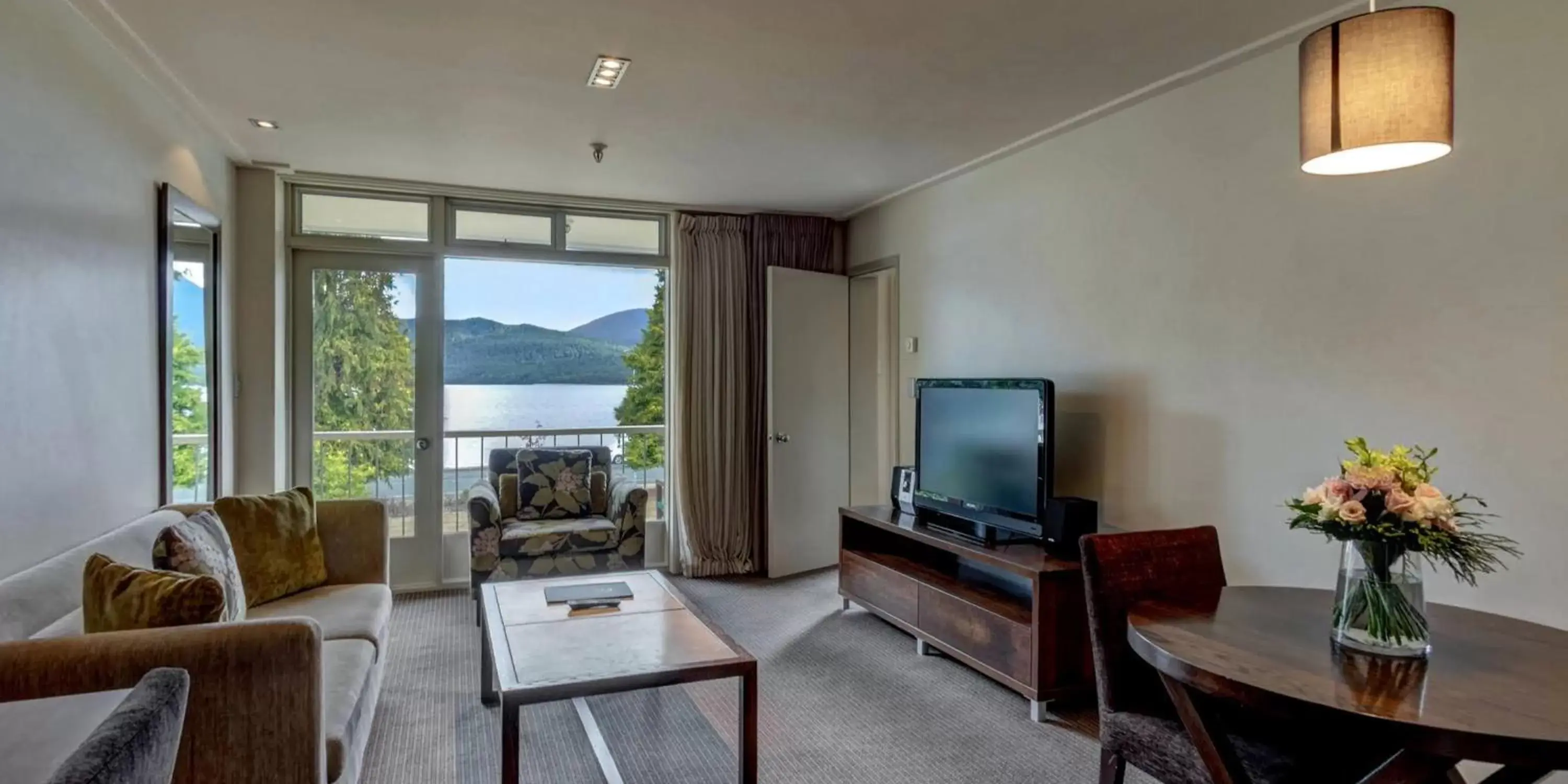 Bed, Seating Area in Distinction Te Anau Hotel & Villas