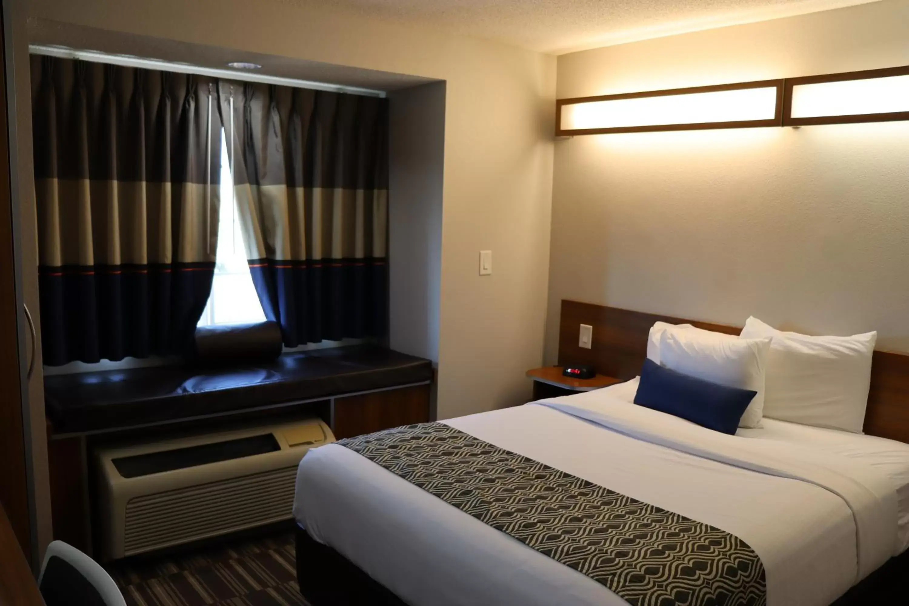 Bed in Microtel Inn & Suites by Wyndham Columbus Near Fort Moore