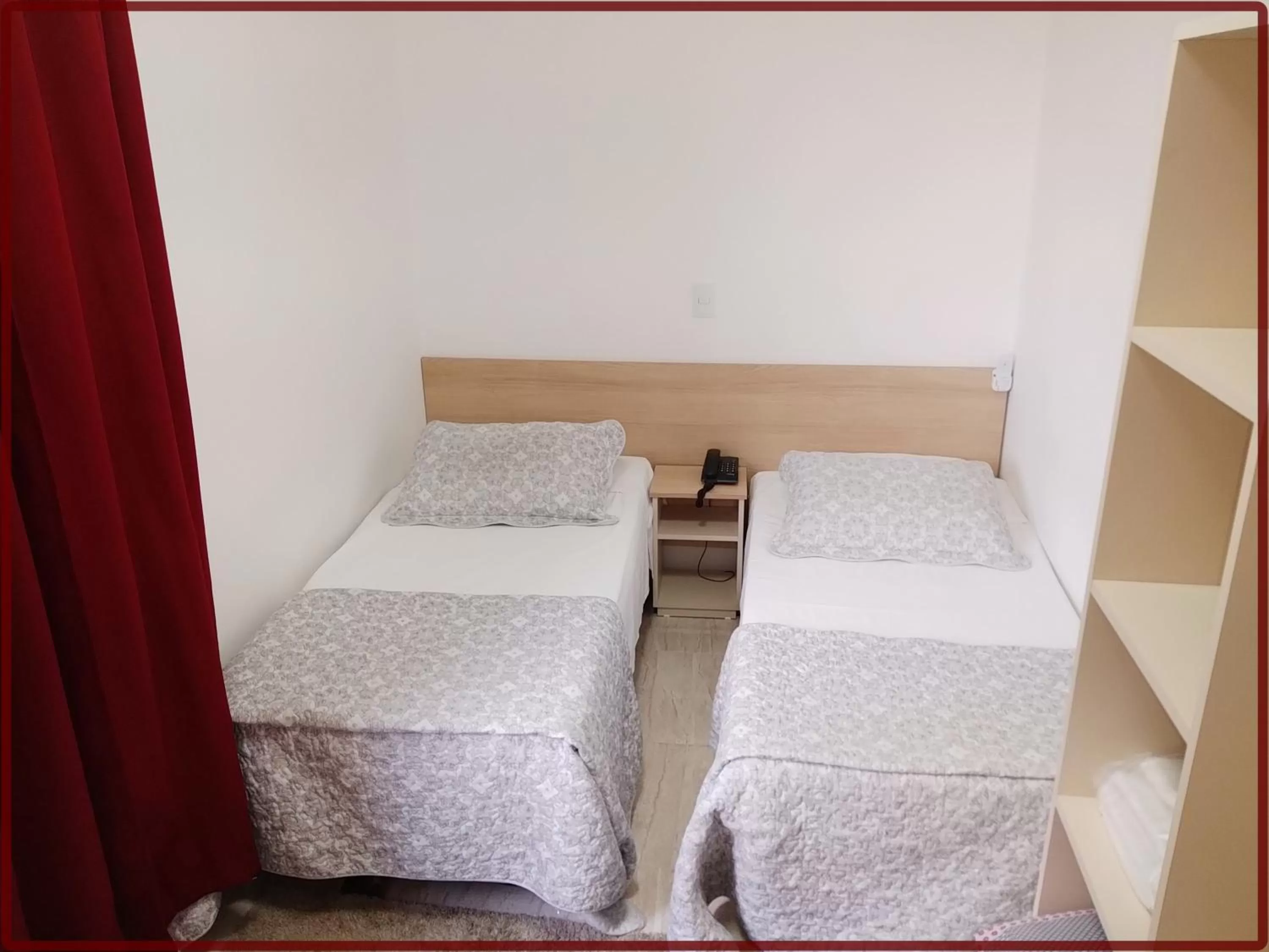 Bed in Hotel Anjos LTDA