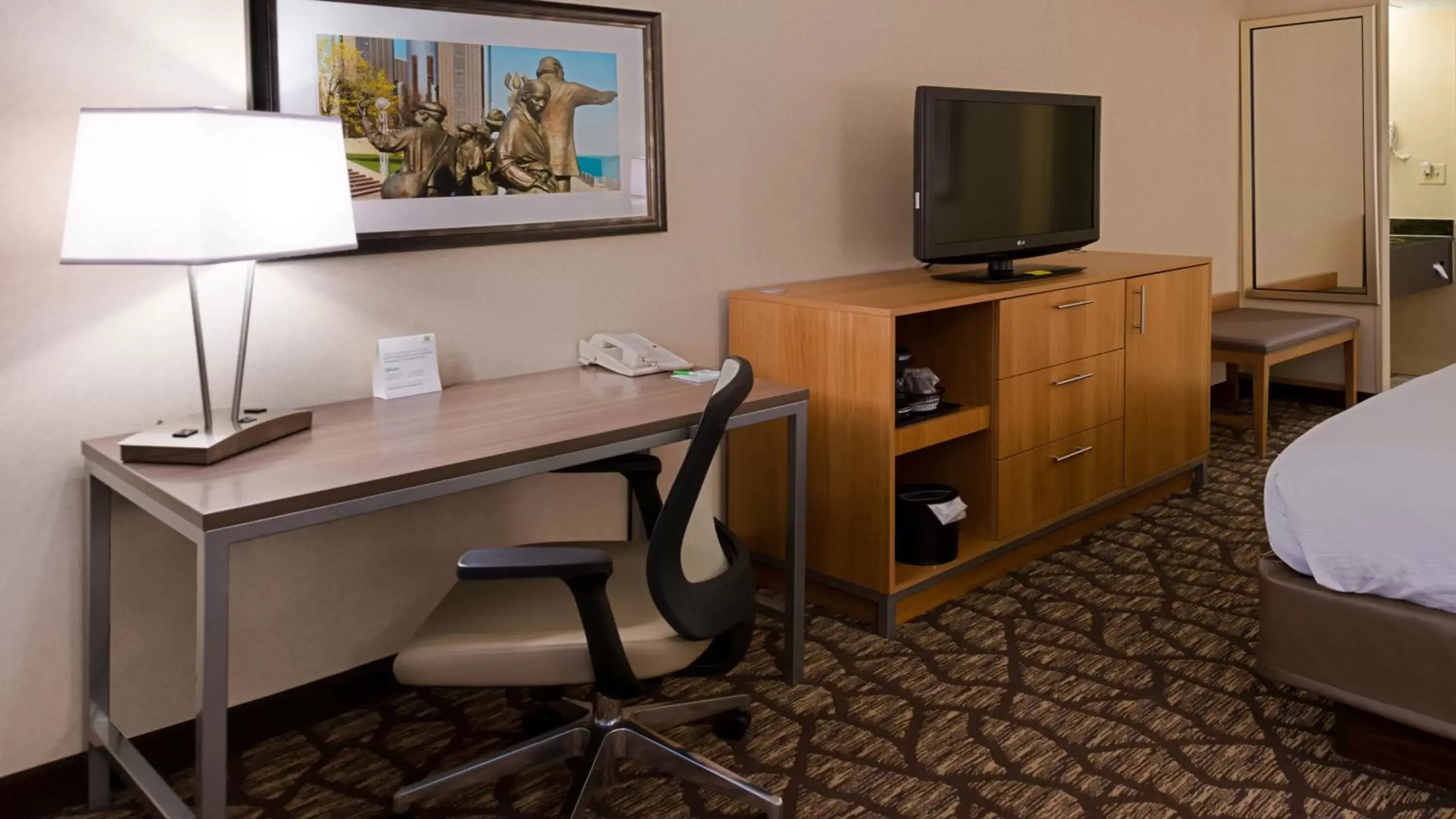 Photo of the whole room, TV/Entertainment Center in Holiday Inn Hotel & Suites Warren, an IHG Hotel