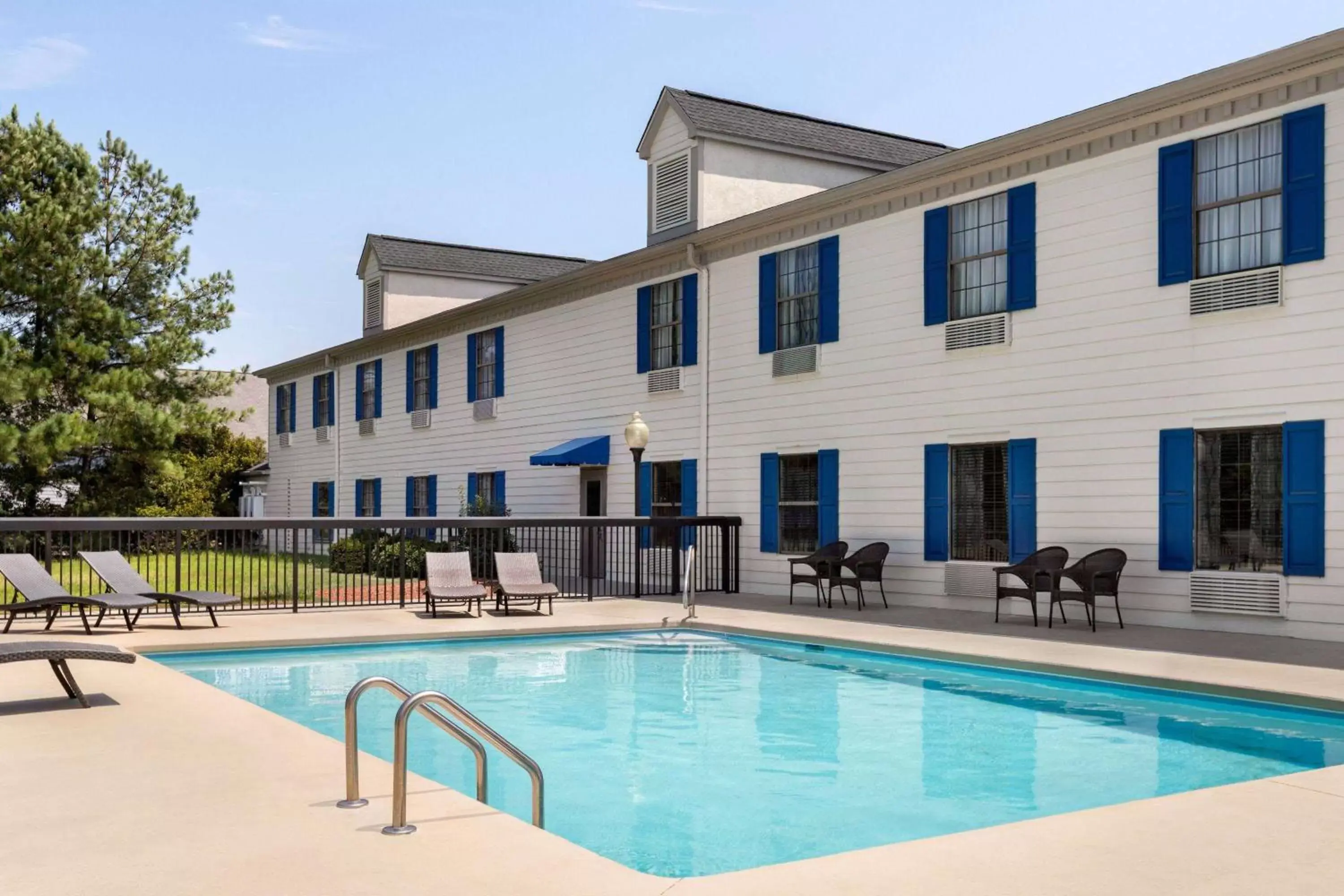 Swimming pool, Property Building in Days Inn by Wyndham Shallotte