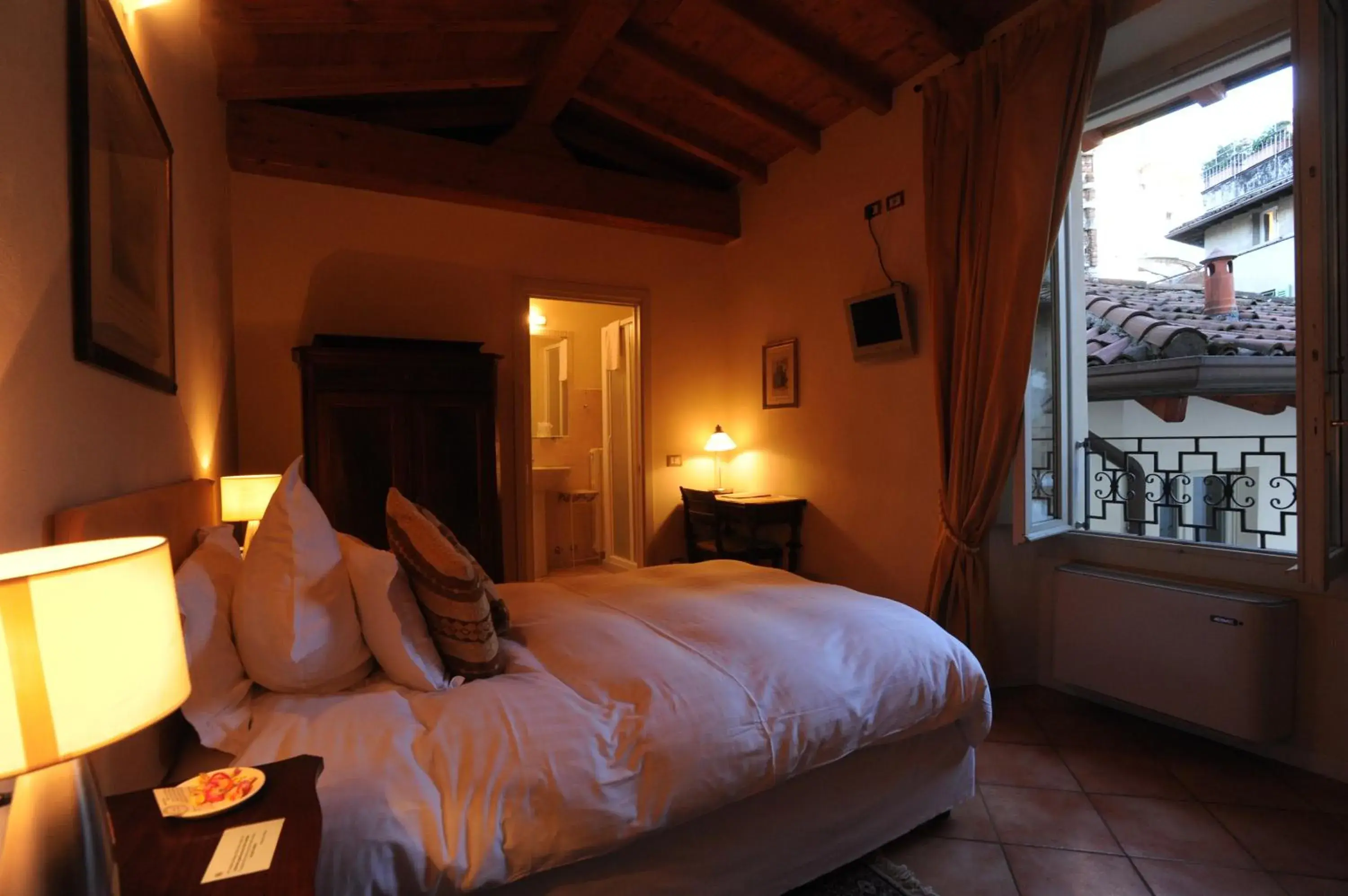 Photo of the whole room, Bed in Albergo Orologio