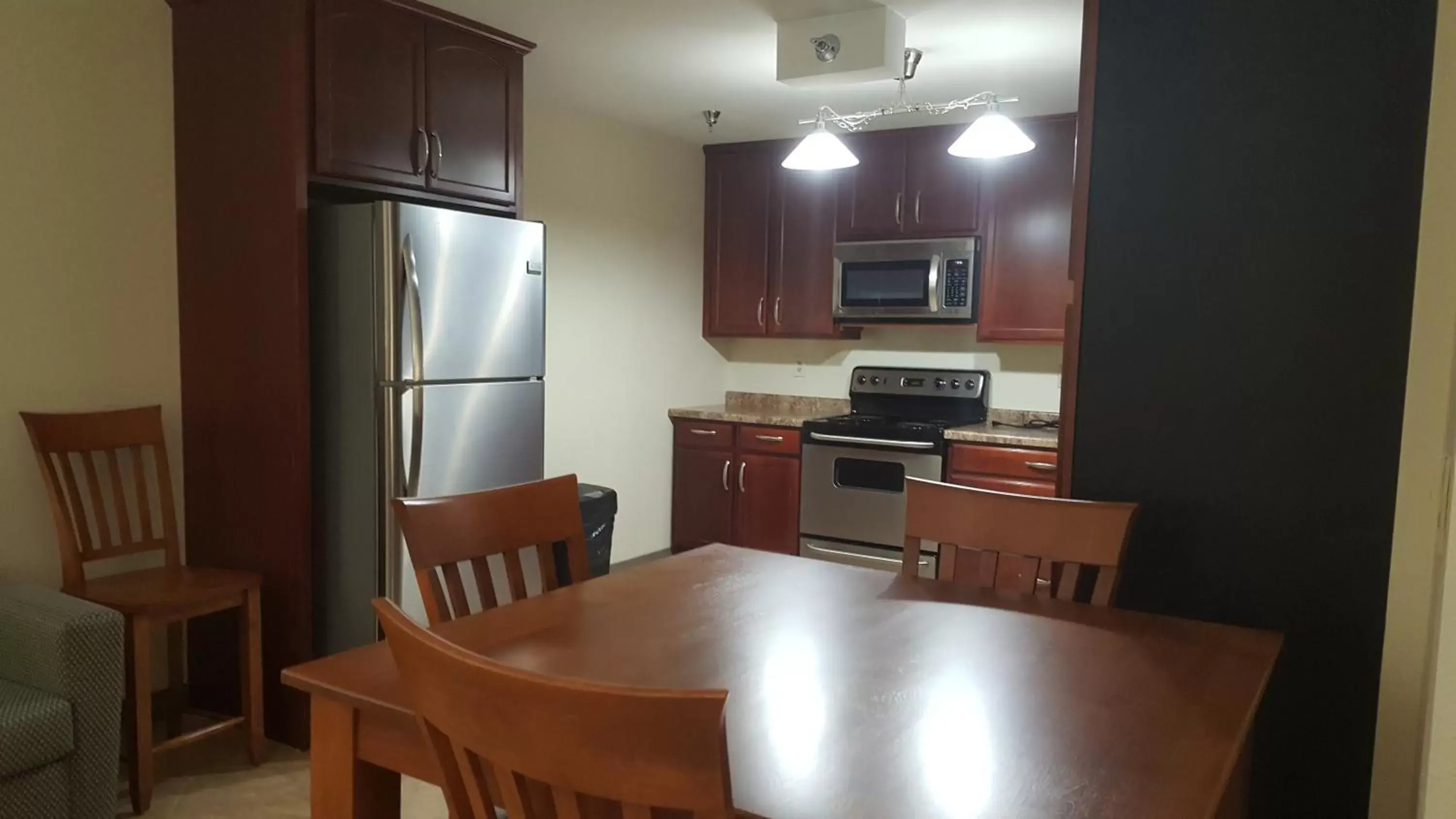 Kitchen or kitchenette, Dining Area in AmericInn by Wyndham Burnsville