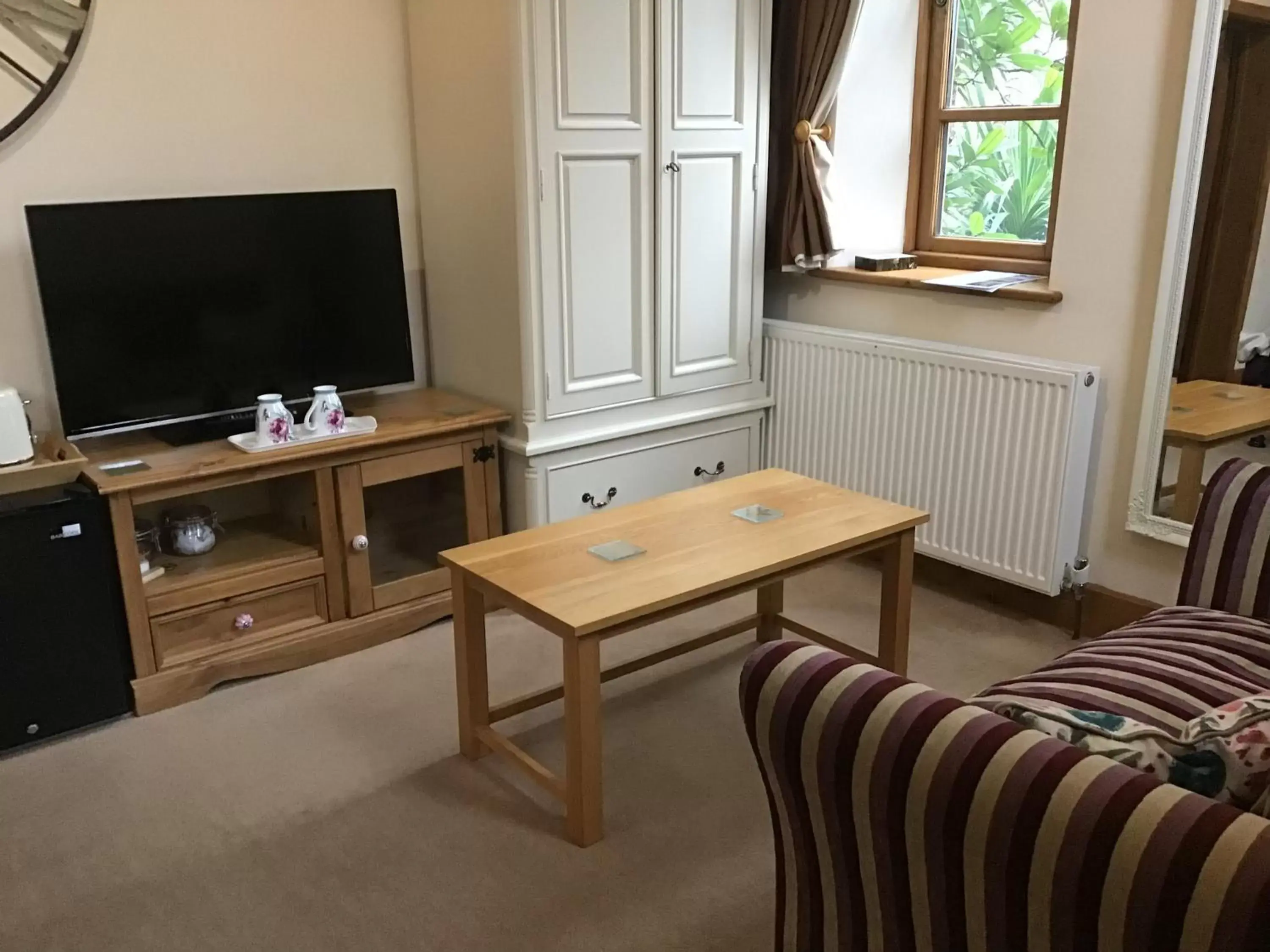 Seating area, TV/Entertainment Center in Old Chapel Forge