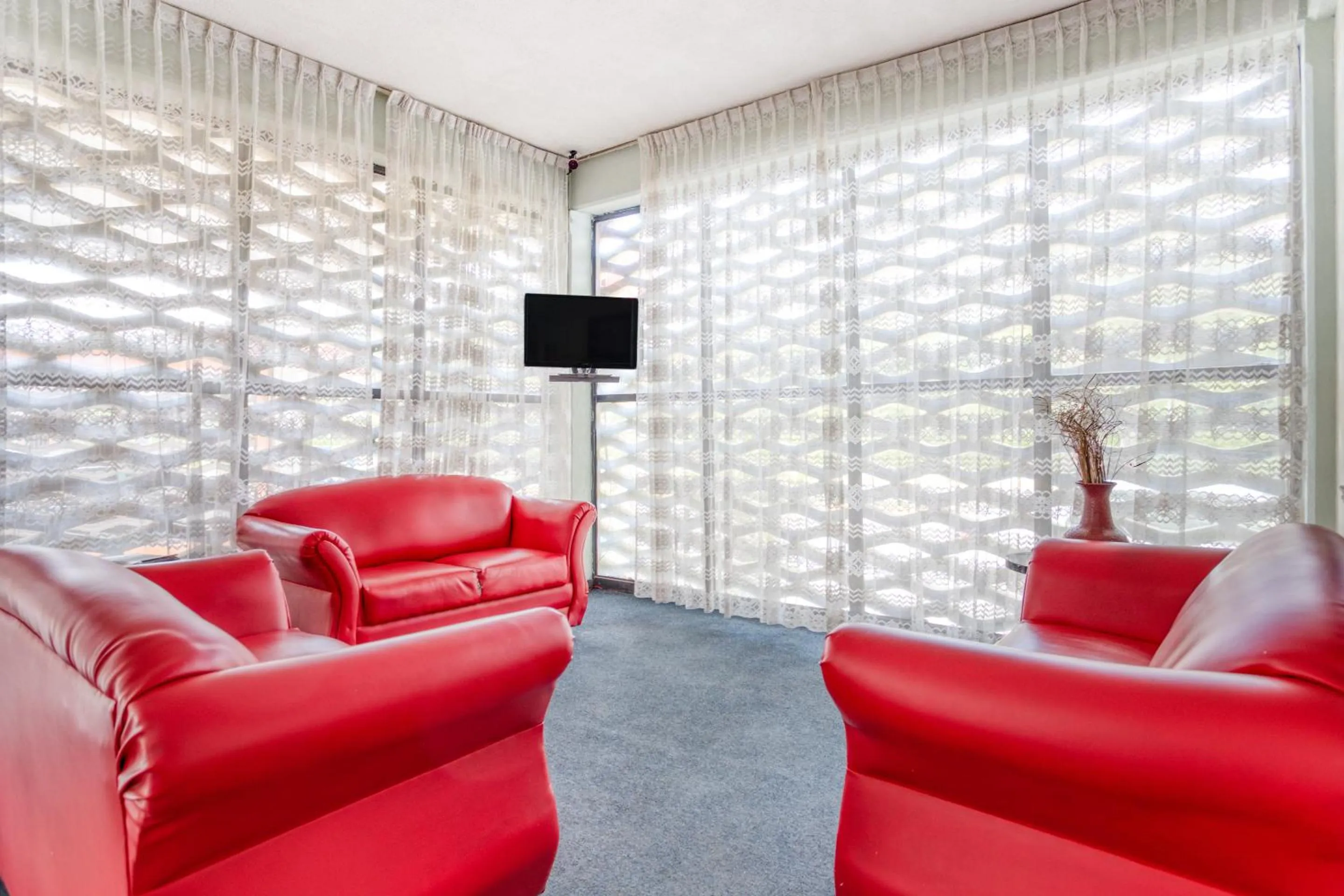 Seating area in Hotel Suites Puebla