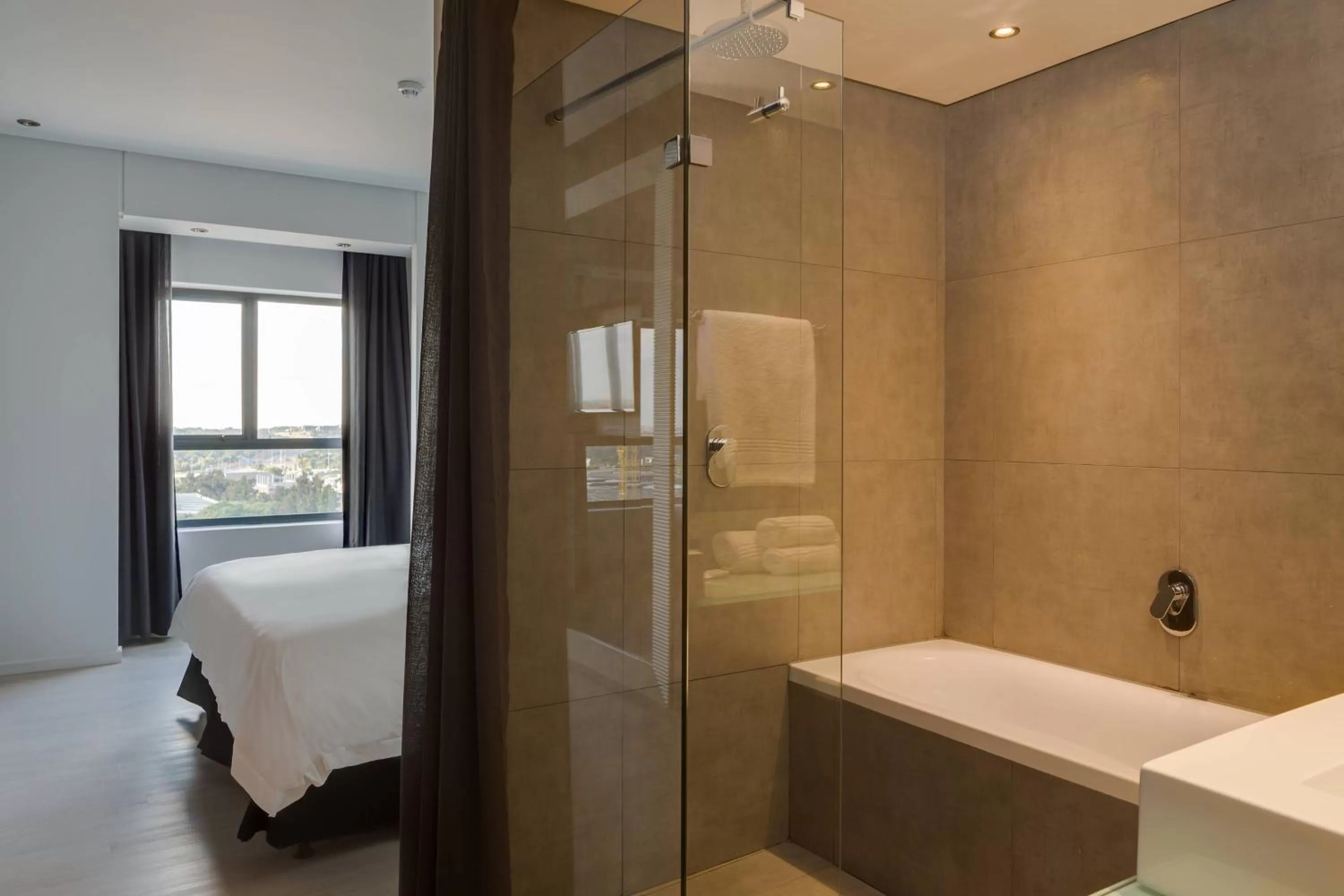 Bathroom, Bed in Protea Hotel Fire & Ice! by Marriott Pretoria Menlyn