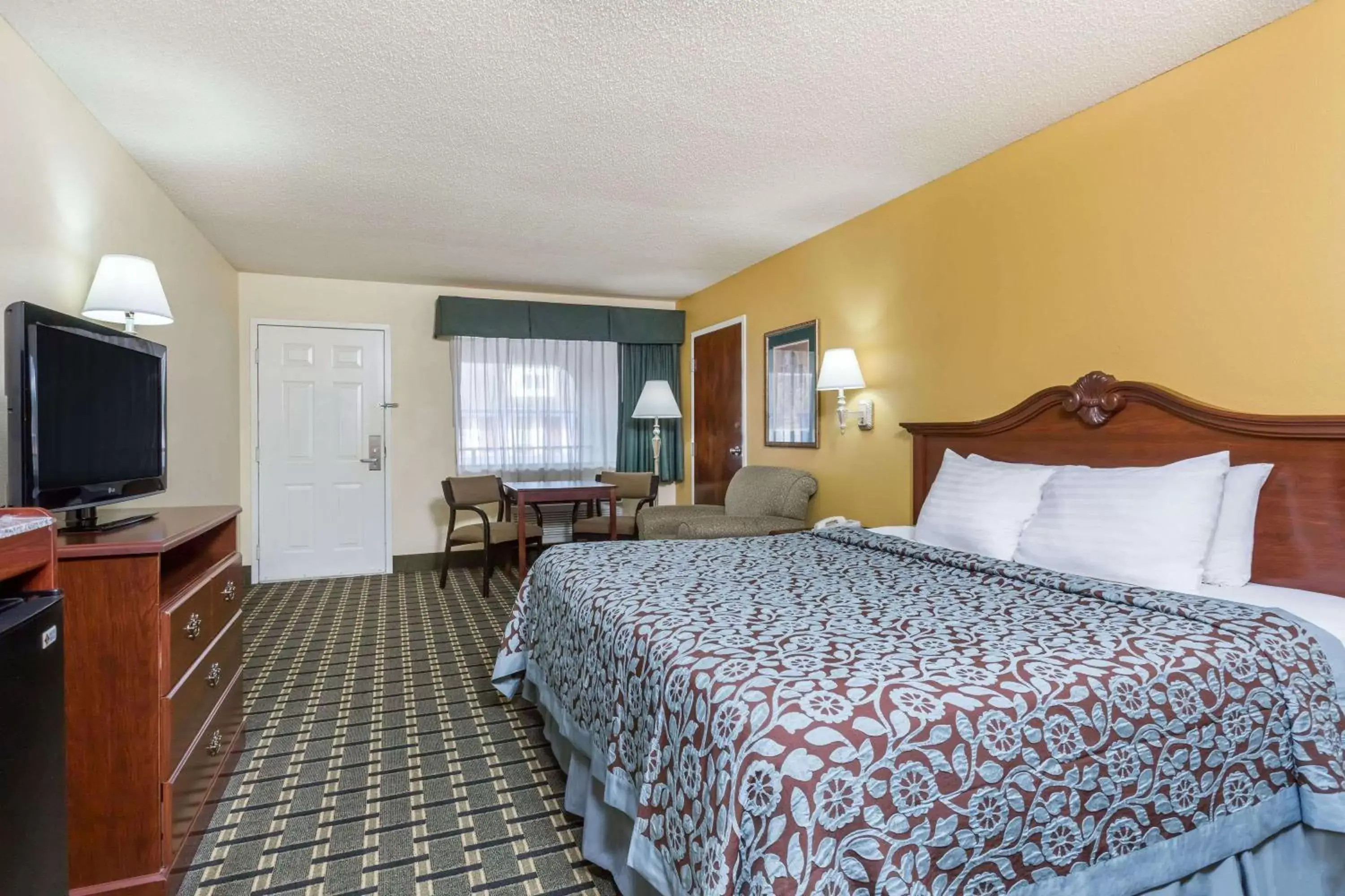 Photo of the whole room in Days Inn & Suites by Wyndham Warner Robins Near Robins AFB