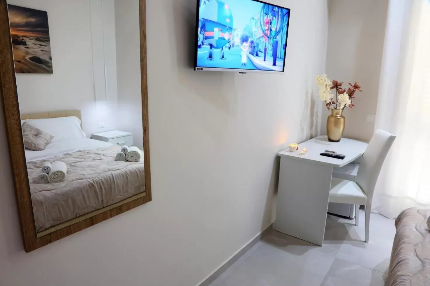 Bed, TV/Entertainment Center in B&B La Nuit