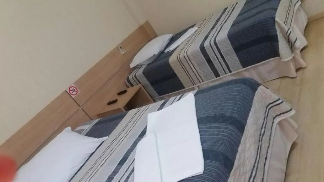 Bed in Onix Inn Hotel