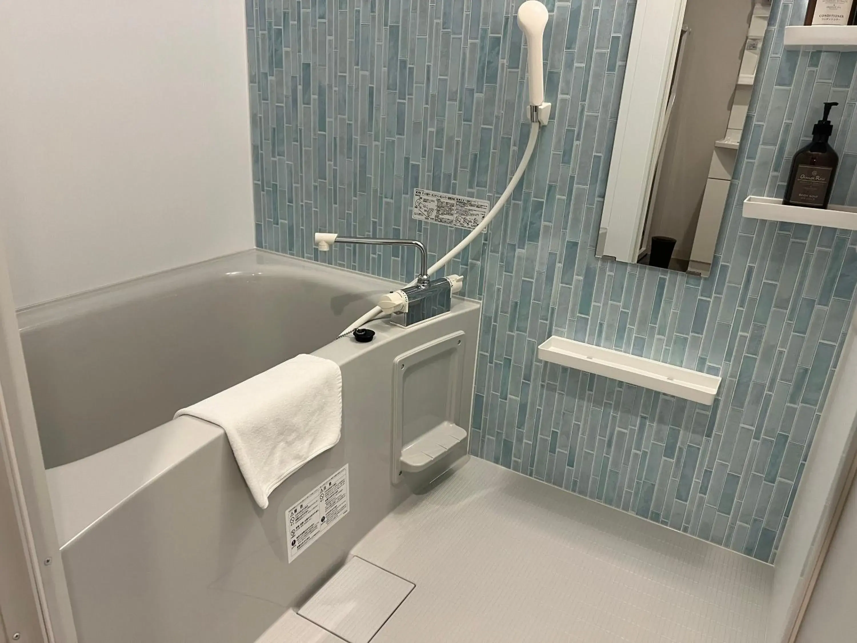 Bathroom in Kariyushi COndominium Resort Naha Living Inn Asahibashiekimae Annex and Premier