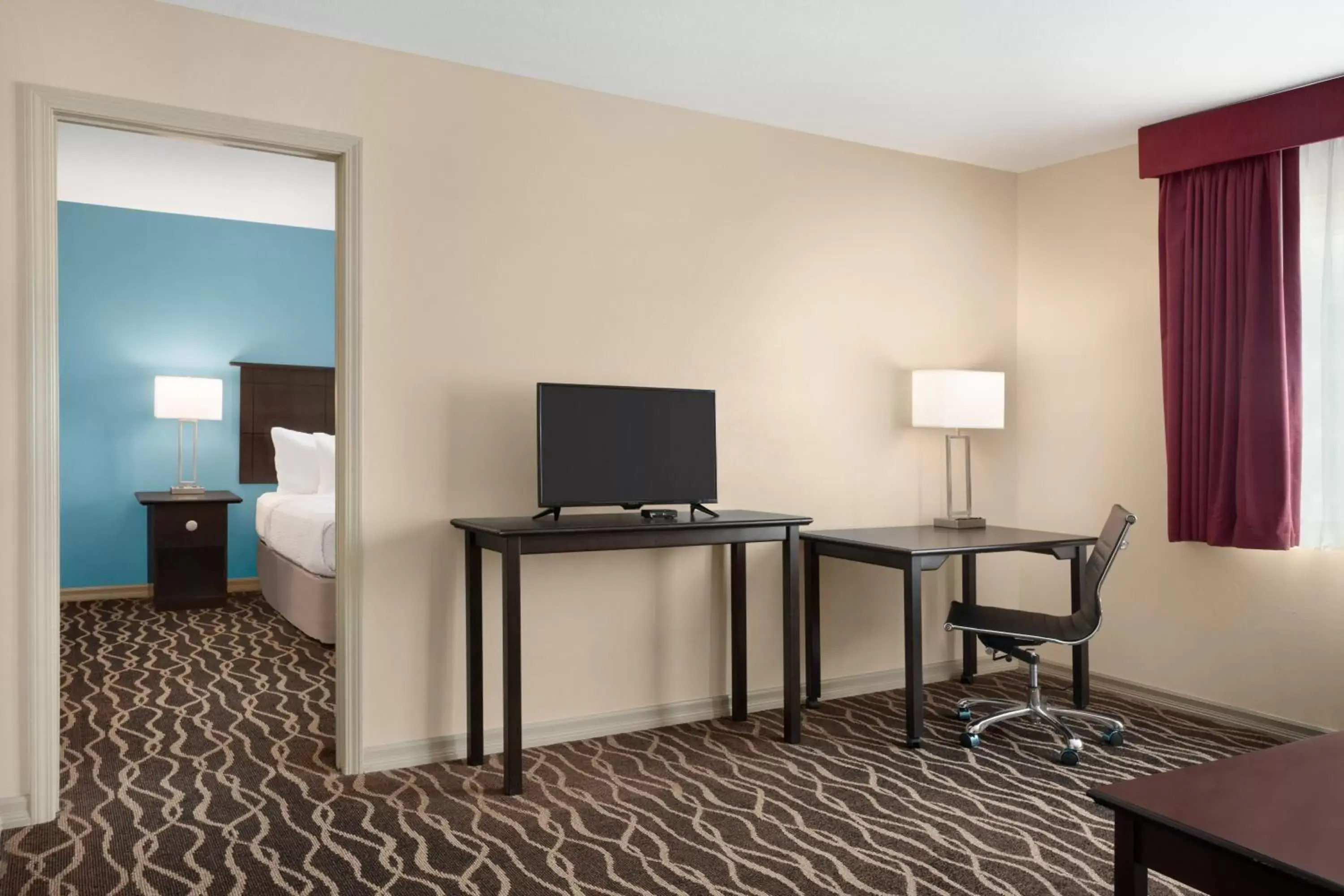 TV/Entertainment Center in Days Inn and Suites by Wyndham Sikeston