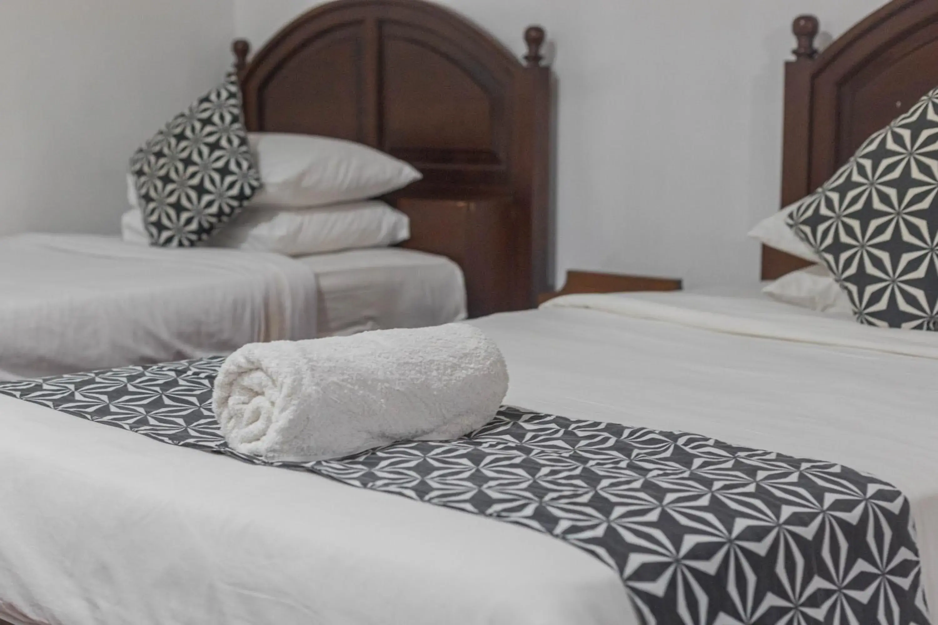 Bed in OYO 3868 Puri Mango Hotel