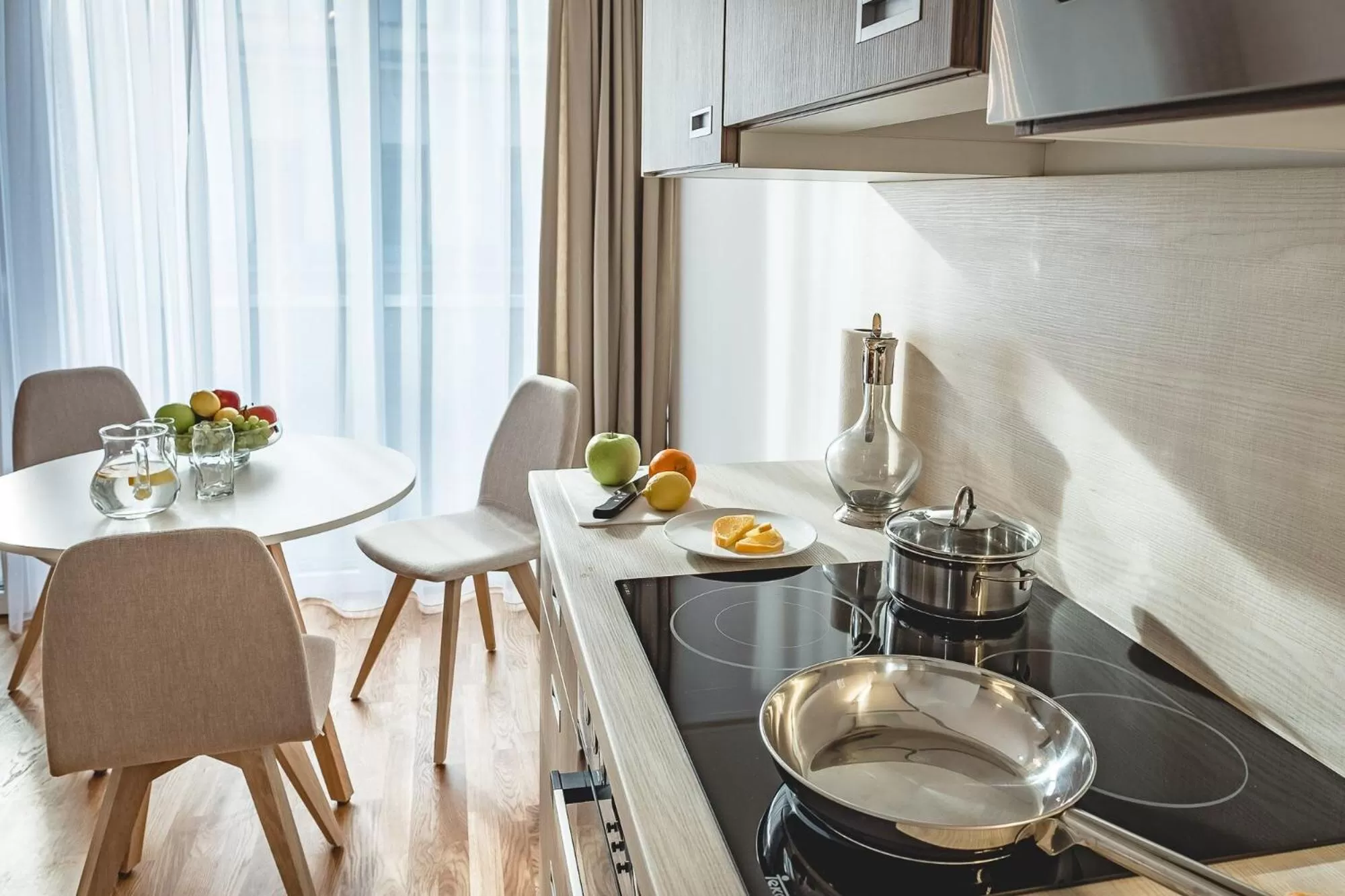 Kitchen or kitchenette in Oliver Apartments | contactless check-in