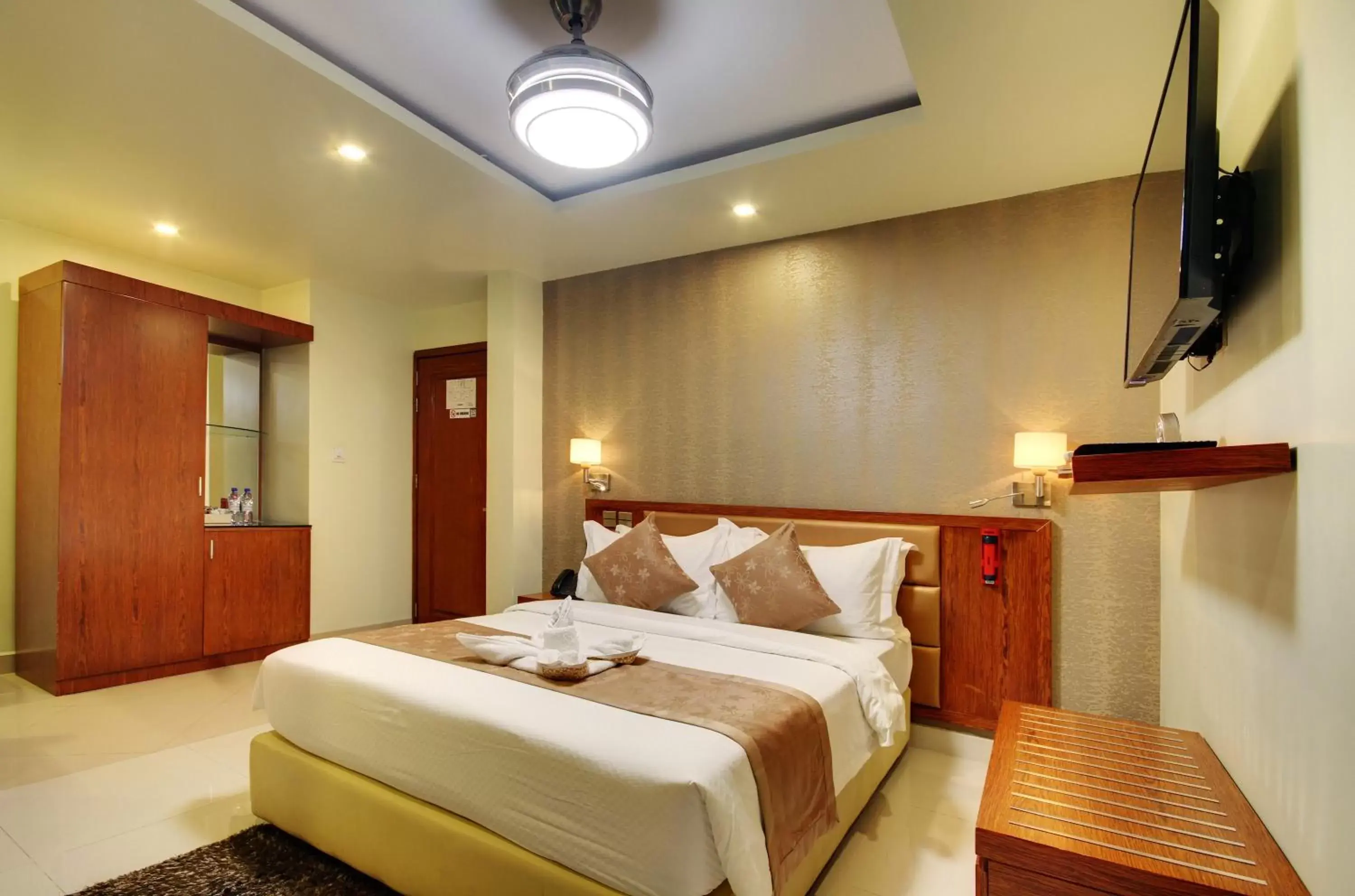 Photo of the whole room, Bed in Unima Grand