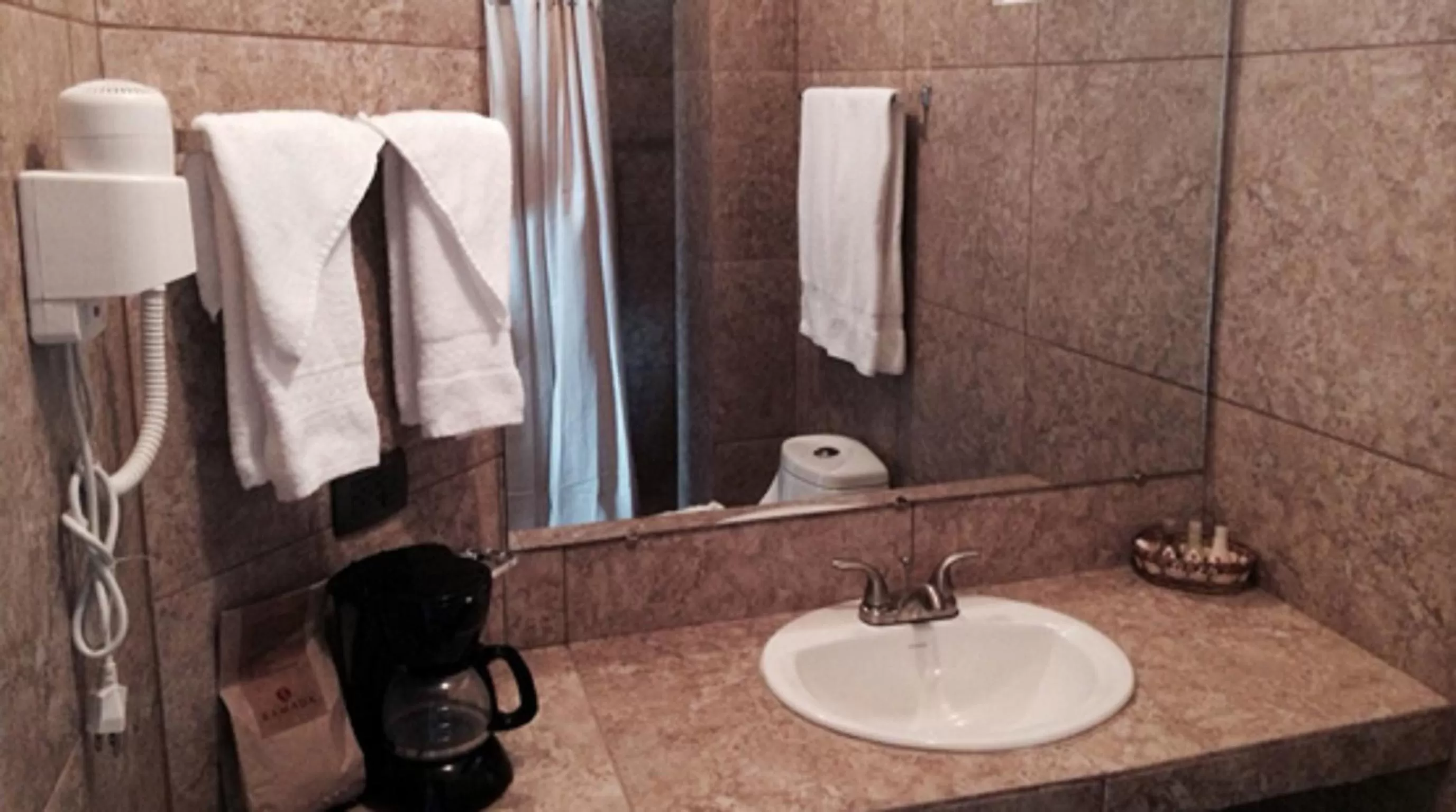 Bathroom in Ramada by Wyndham Tikal Isla de Flores