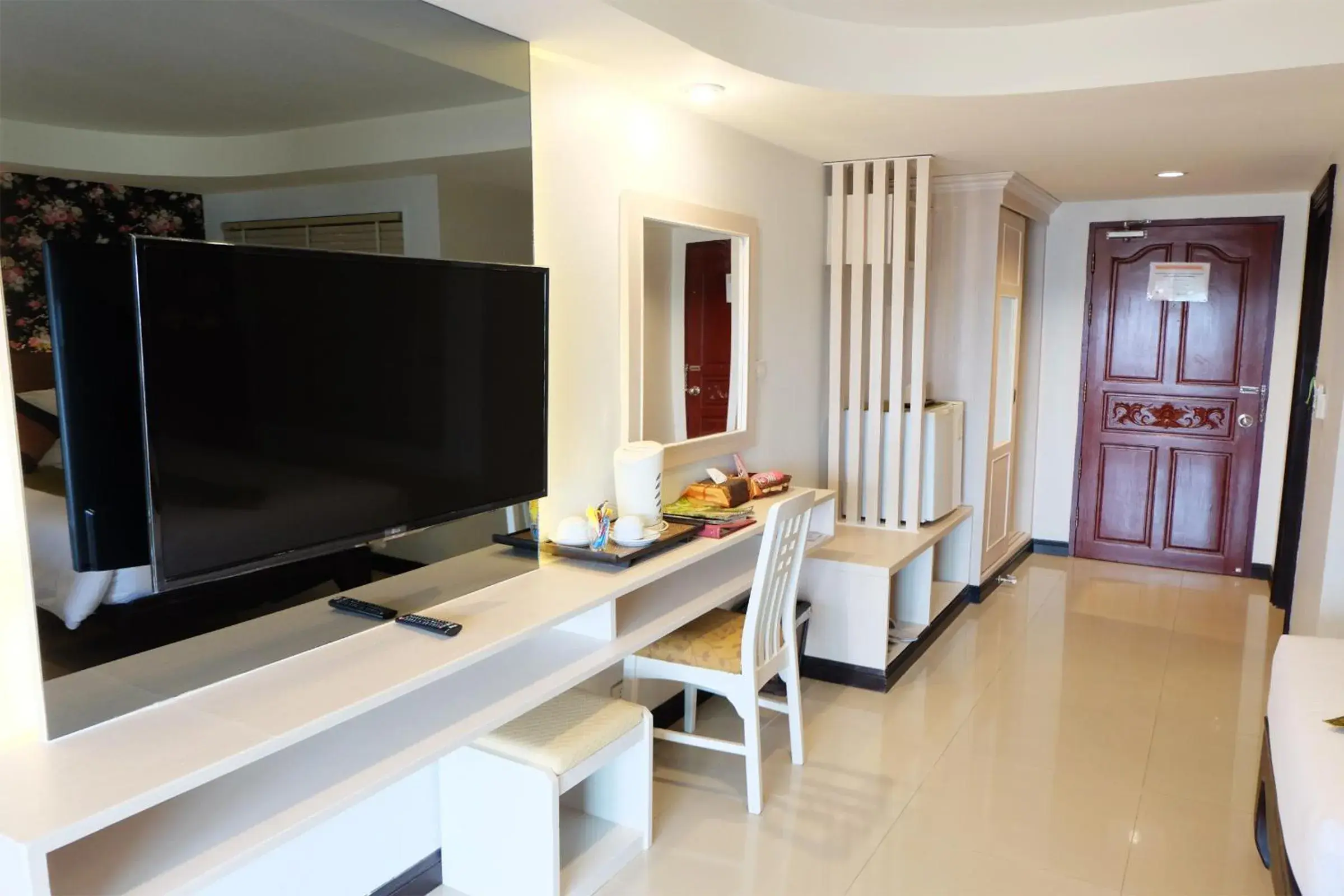 TV and multimedia, TV/Entertainment Center in Grand Hill Resort and Spa