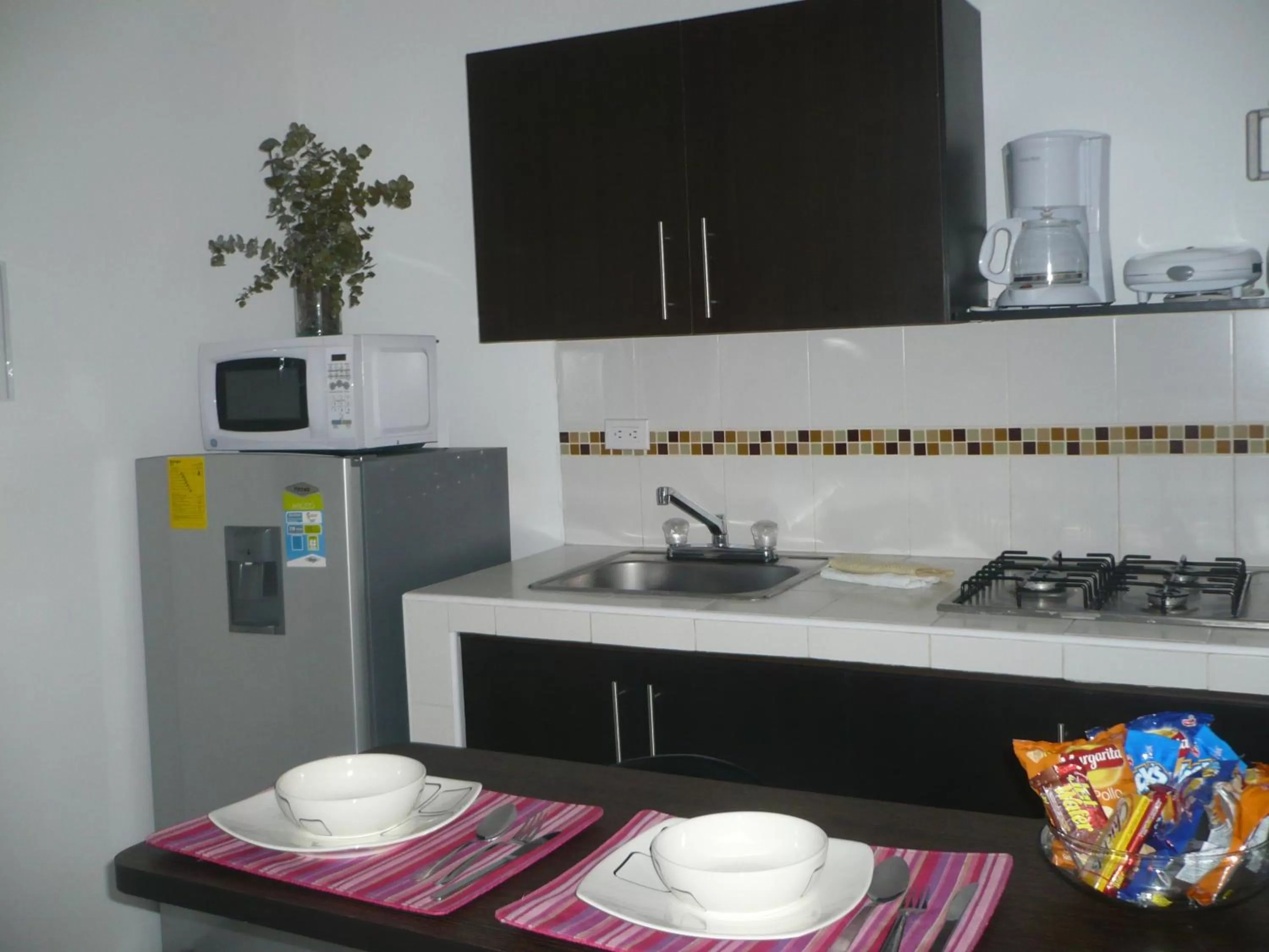 Kitchen or kitchenette in Apartasuites San Marcos