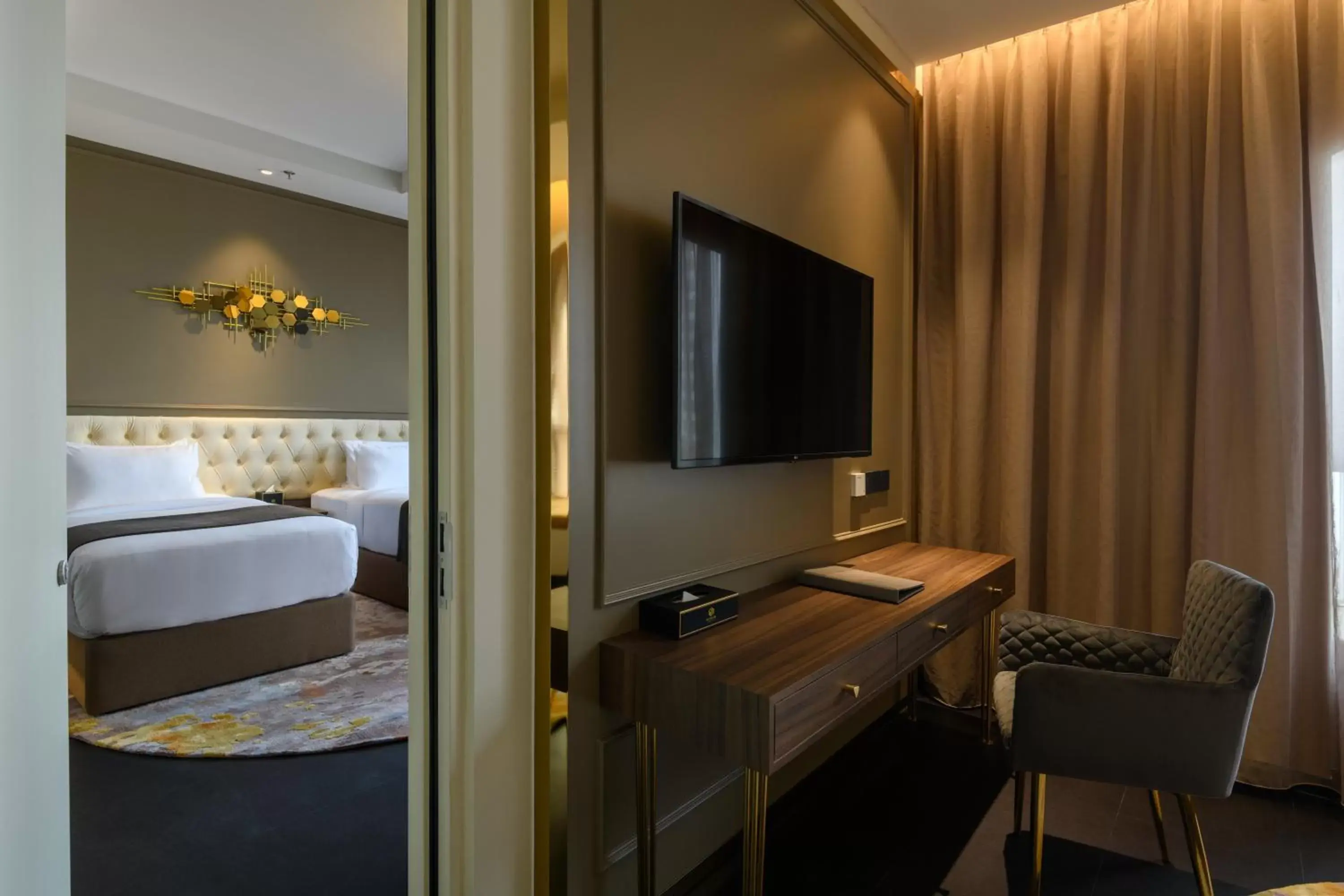 Bed, TV/Entertainment Center in The Granite Luxury Hotel Penang