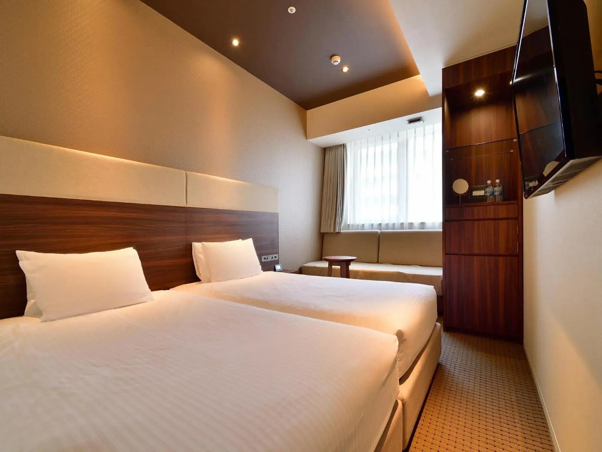 Photo of the whole room, Bed in Hotel Aqua Citta Naha