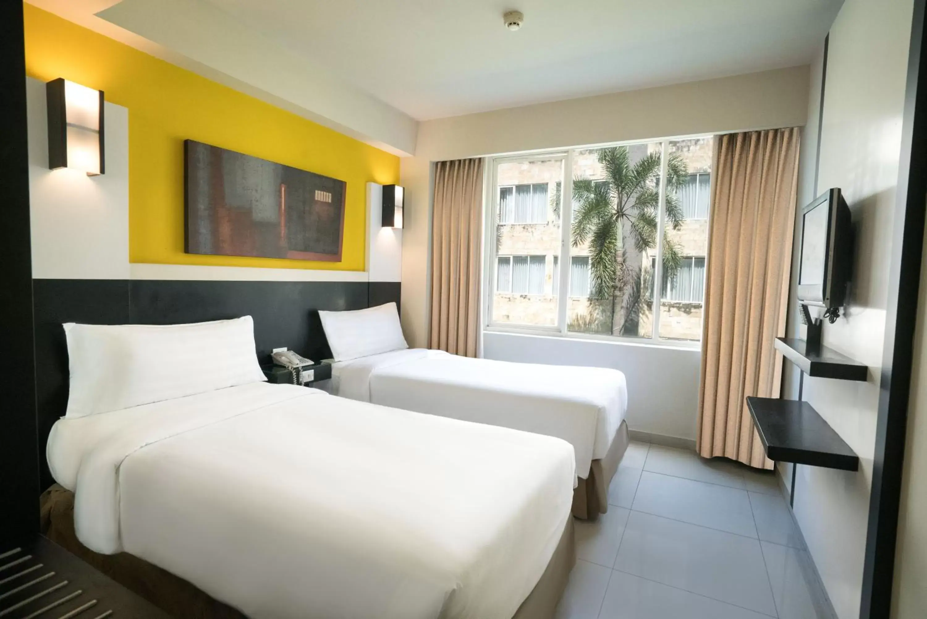 Bed in ASTON Denpasar Hotel & Convention