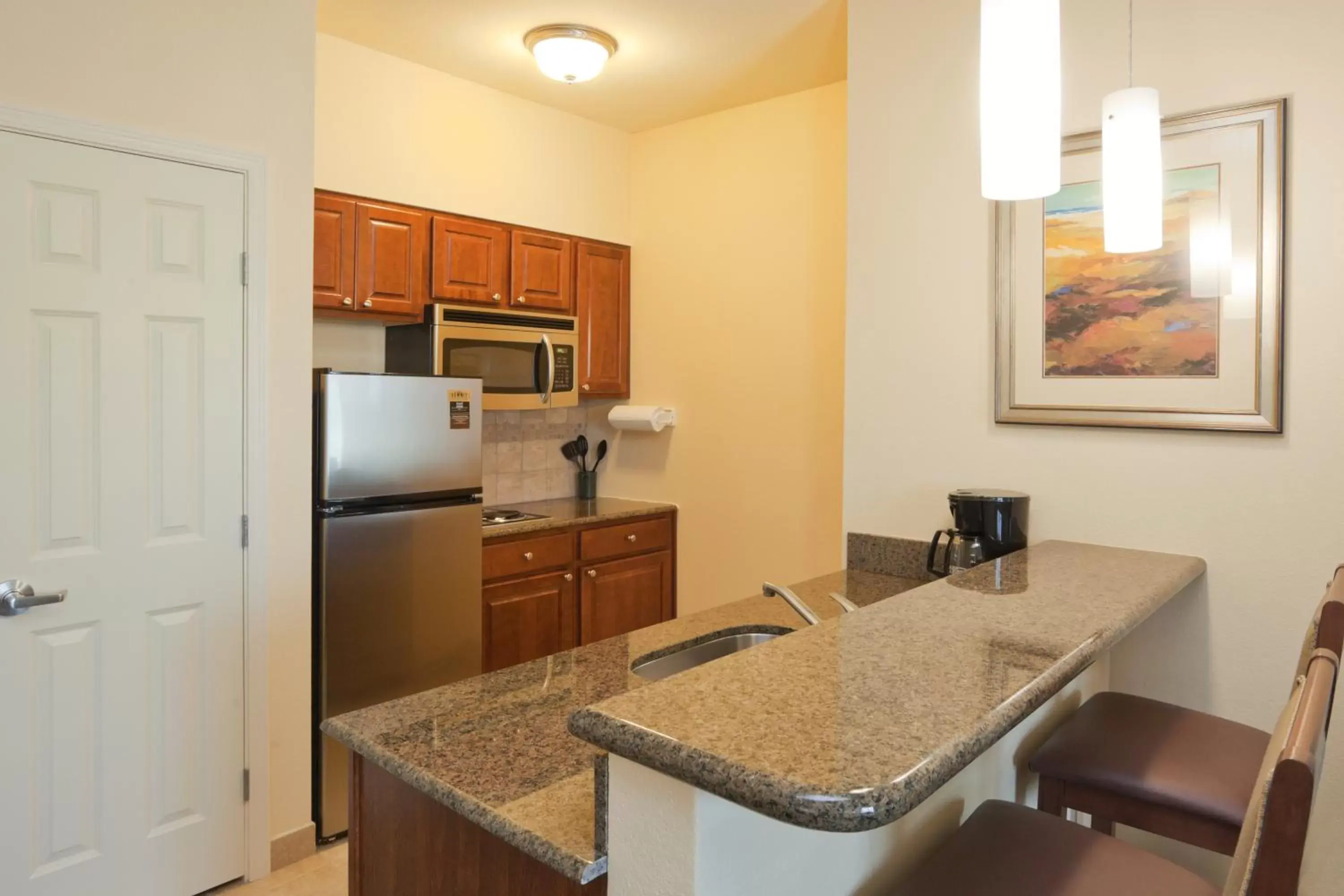 Photo of the whole room, Kitchen/Kitchenette in Staybridge Suites Lafayette-Airport, an IHG Hotel