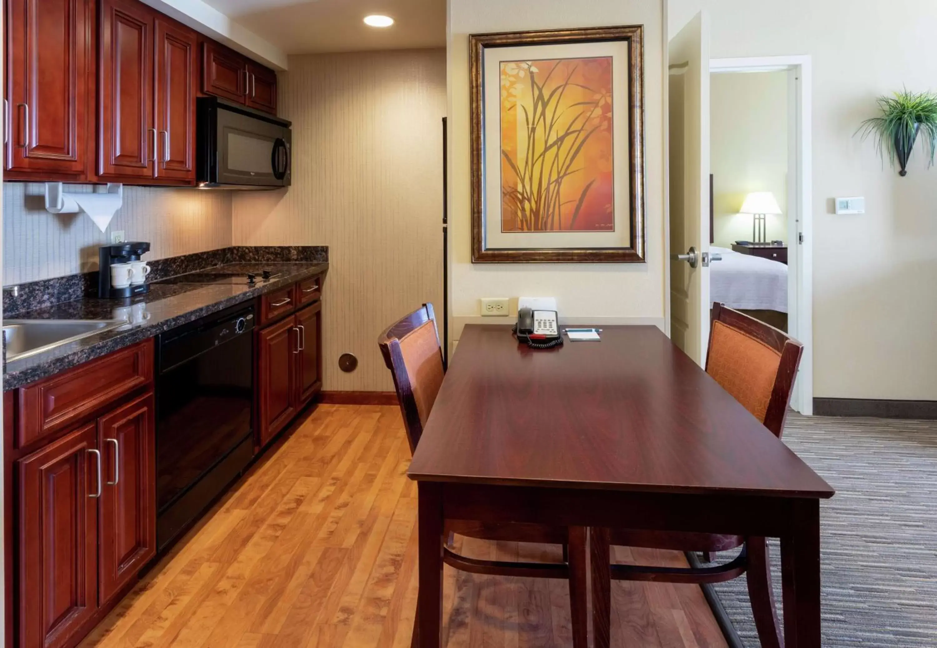 Bedroom, Kitchen/Kitchenette in Homewood Suites by Hilton Minneapolis - Saint Louis Park at West End