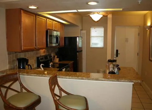 Kitchen or kitchenette in Vacation Villas 2, a Ramada by Wyndham