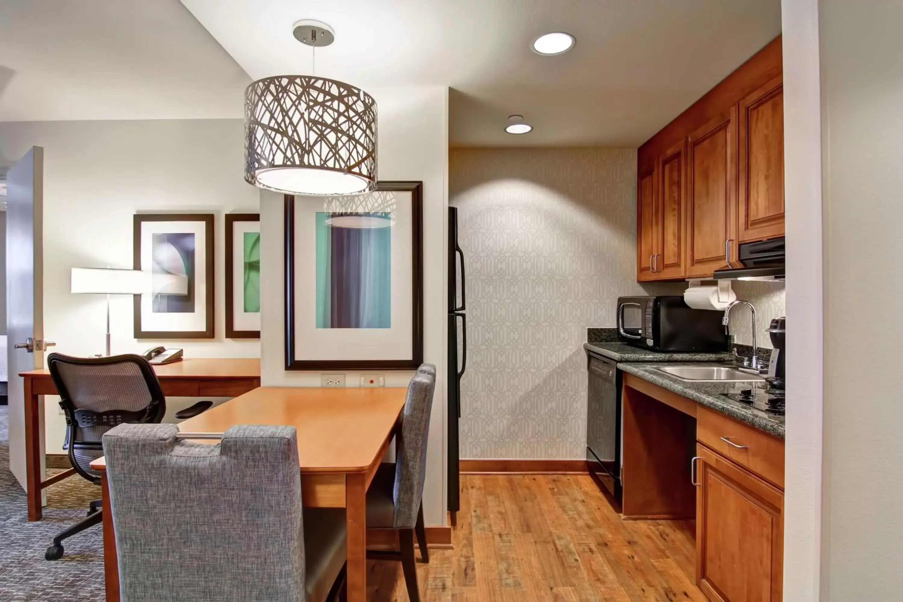 Bedroom, Kitchen/Kitchenette in Homewood Suites by Hilton Omaha - Downtown