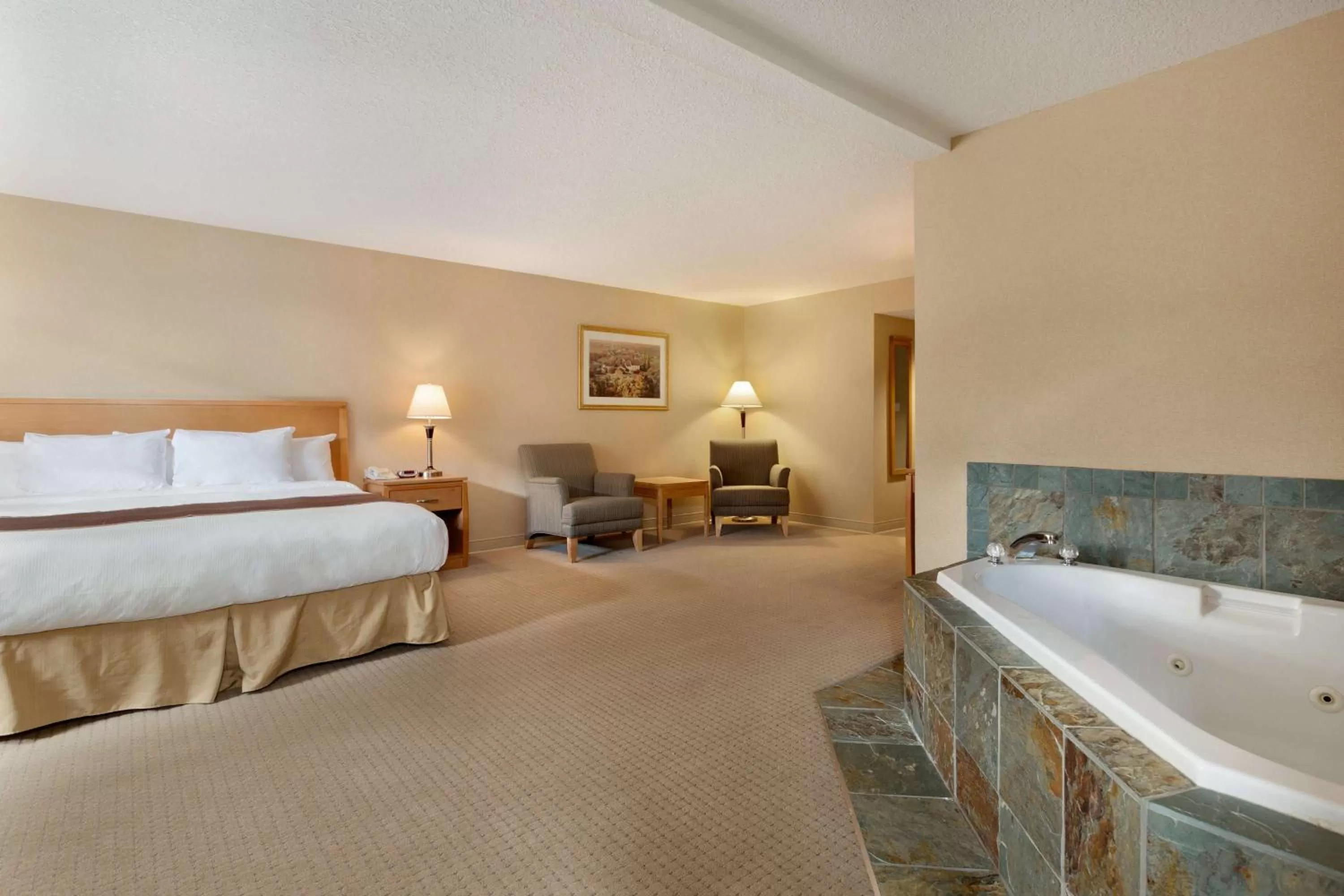 Photo of the whole room, Bed in Ramada by Wyndham Nanaimo