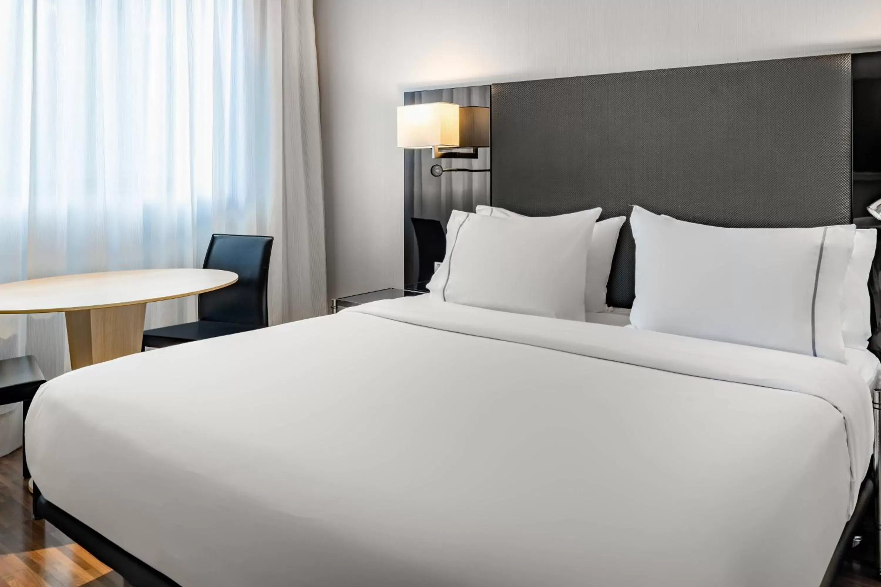 Photo of the whole room, Bed in AC Hotel Madrid Feria by Marriott