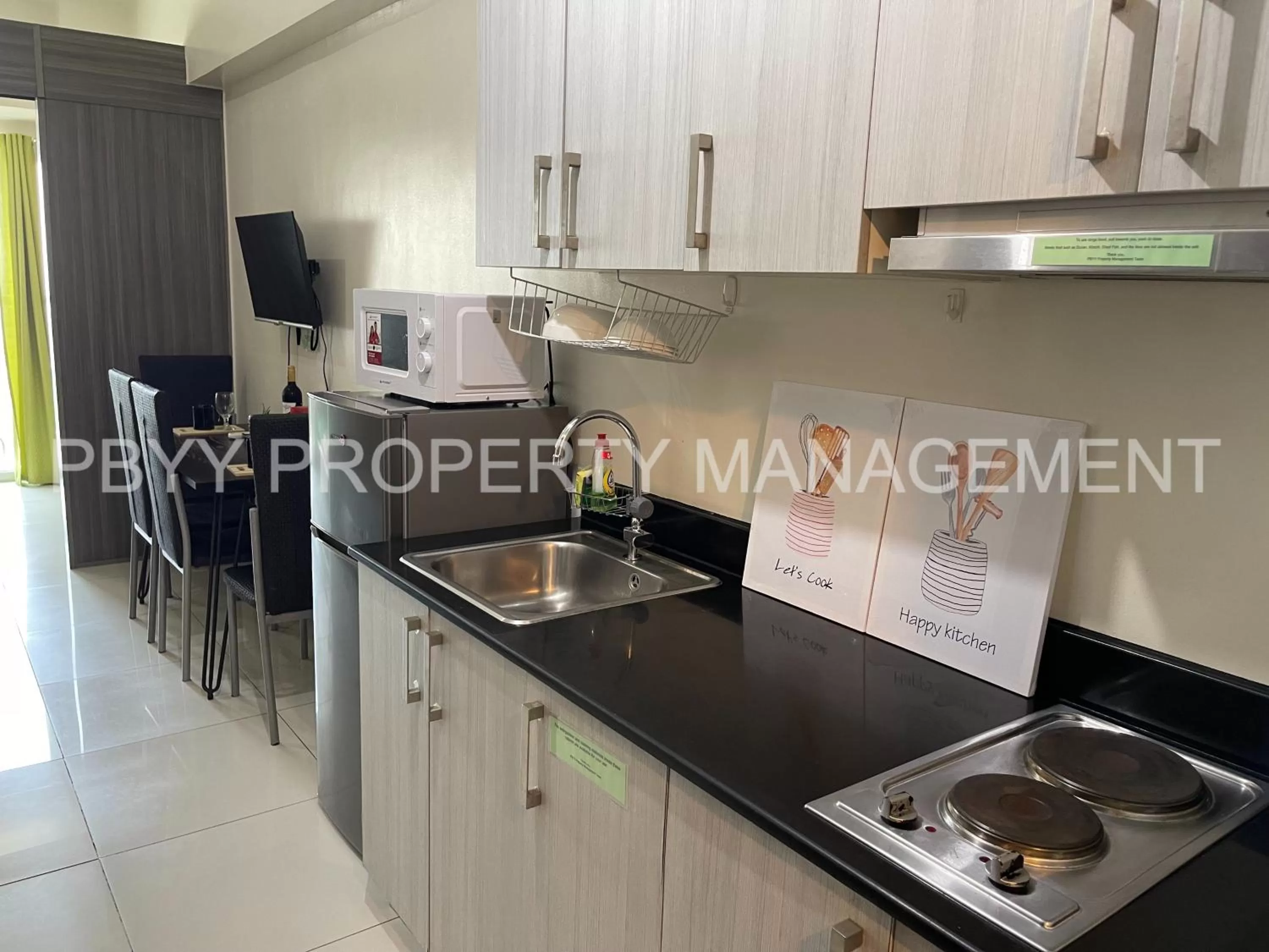 Kitchen or kitchenette in Green Residences Stays by PBYY