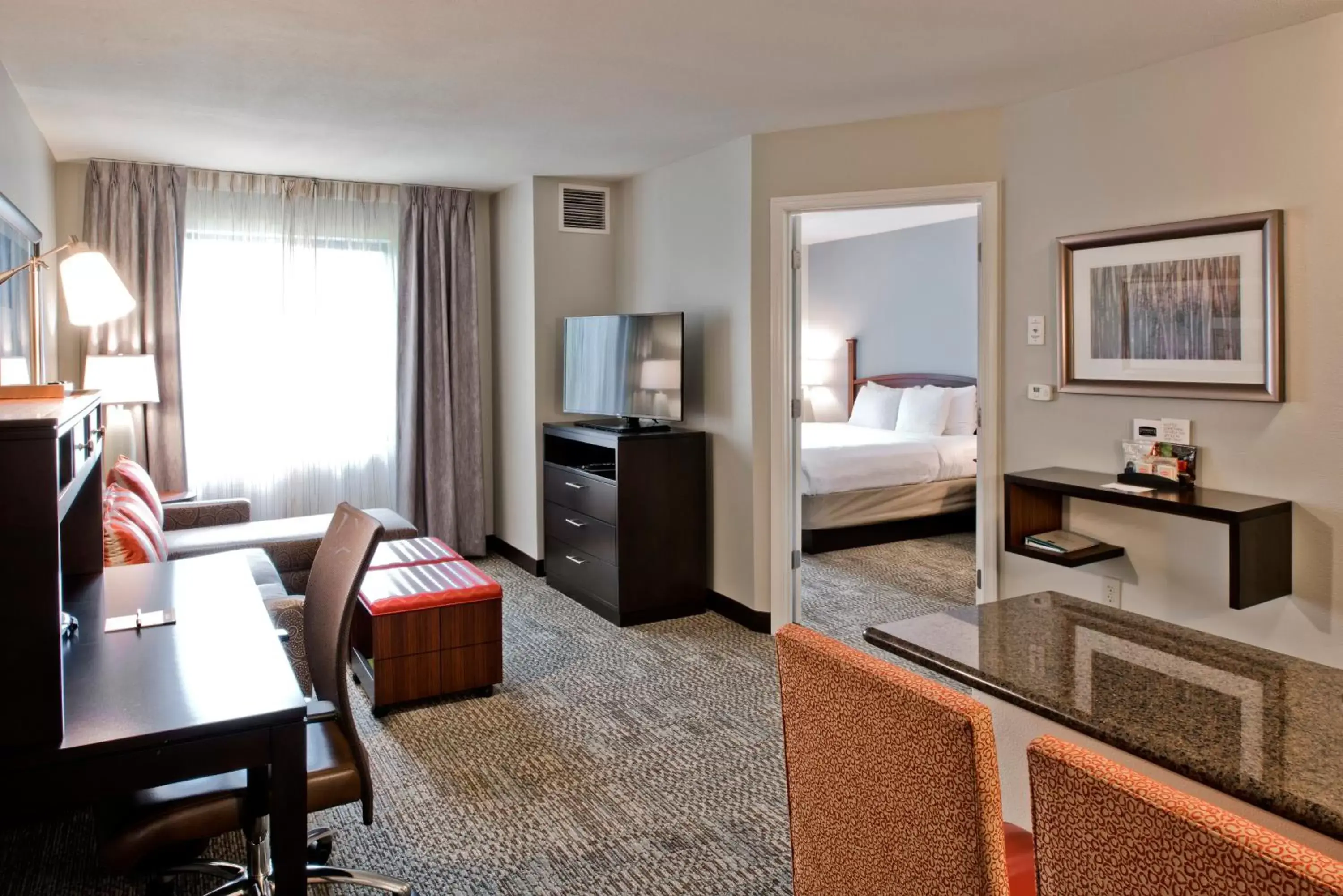 Photo of the whole room, TV/Entertainment Center in Staybridge Suites - Charlotte Ballantyne, an IHG Hotel