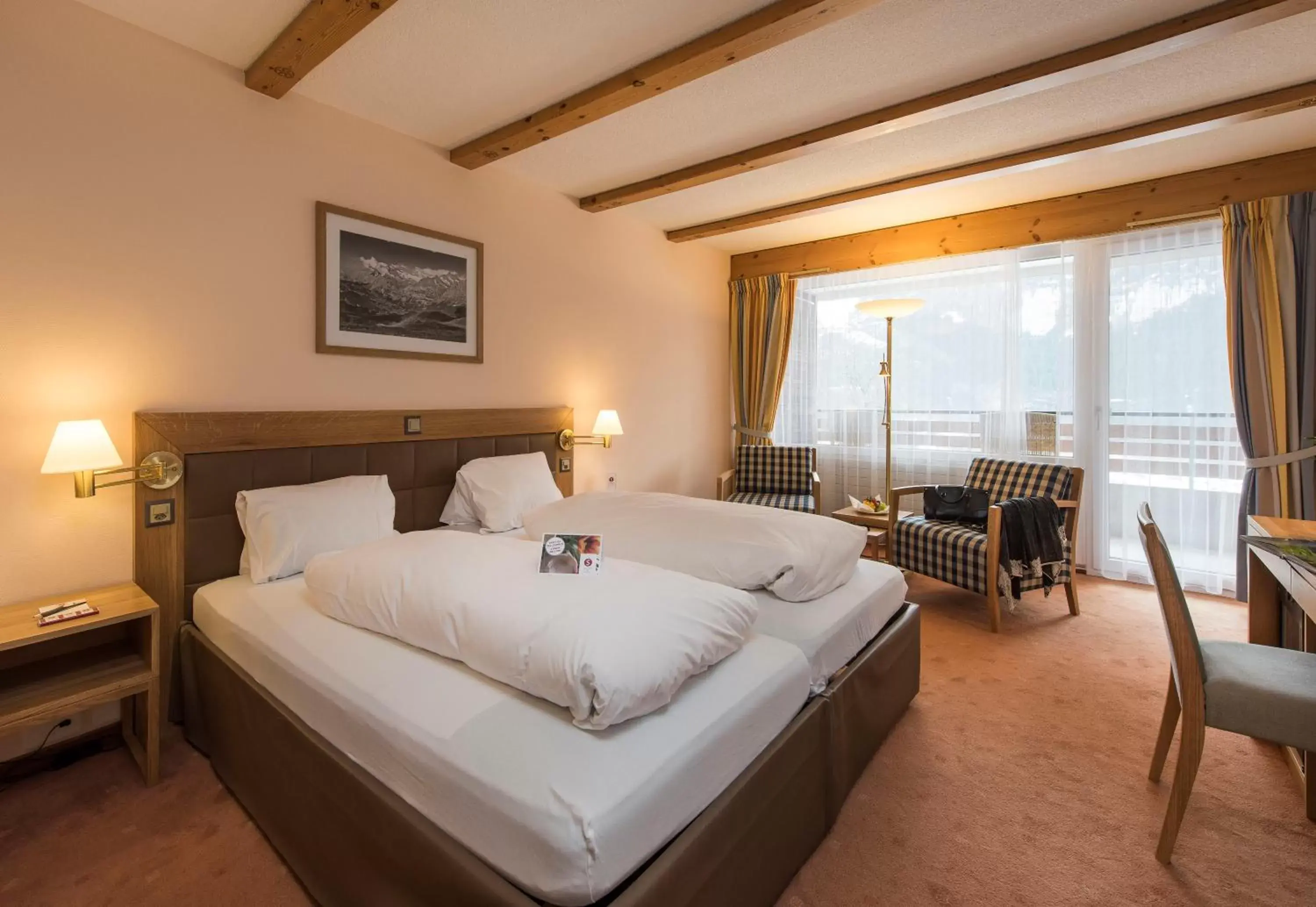 Photo of the whole room, Bed in Sunstar Hotel & SPA Grindelwald