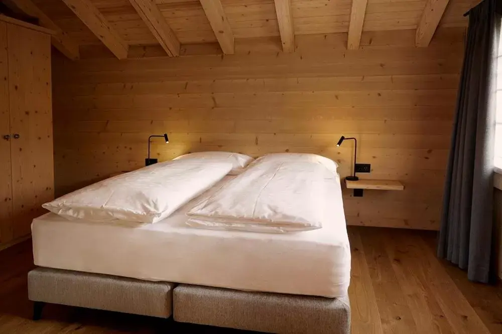 Bed in Hotel Alpenland