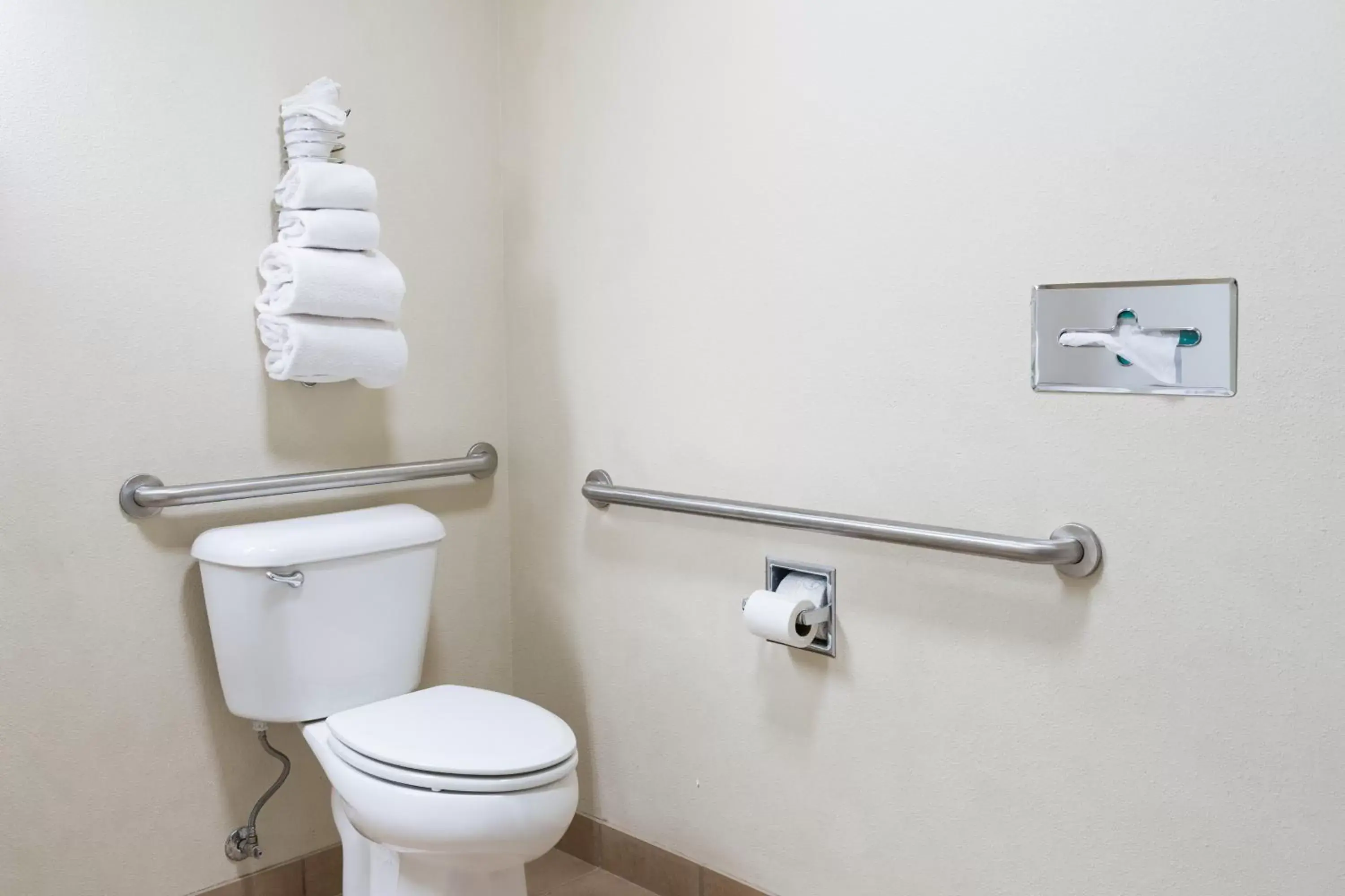 Toilet, Bathroom in Pinedale Hotel & Suites