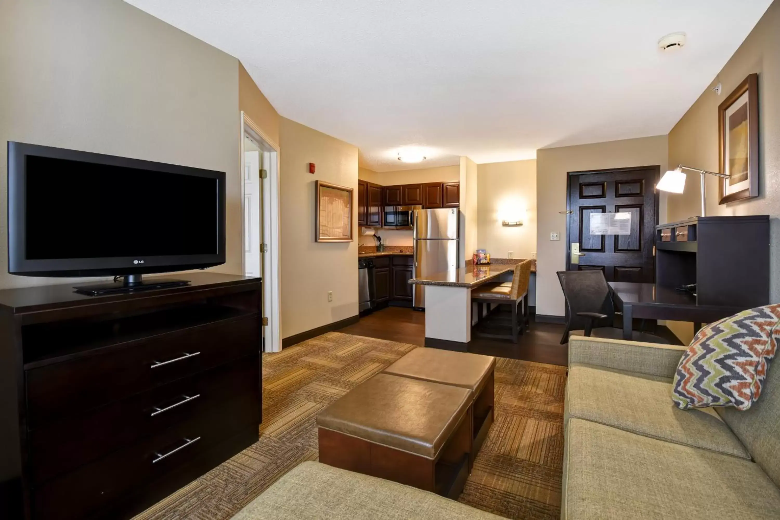 Photo of the whole room, TV/Entertainment Center in Staybridge Suites Grand Rapids-Kentwood, an IHG Hotel