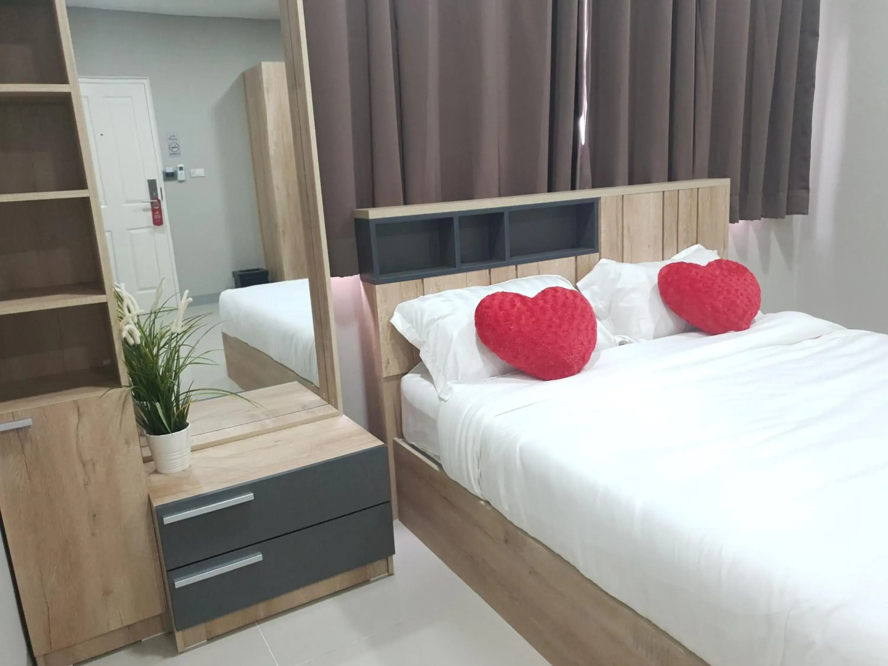 Bed in iResidence Hotel Pathumthani