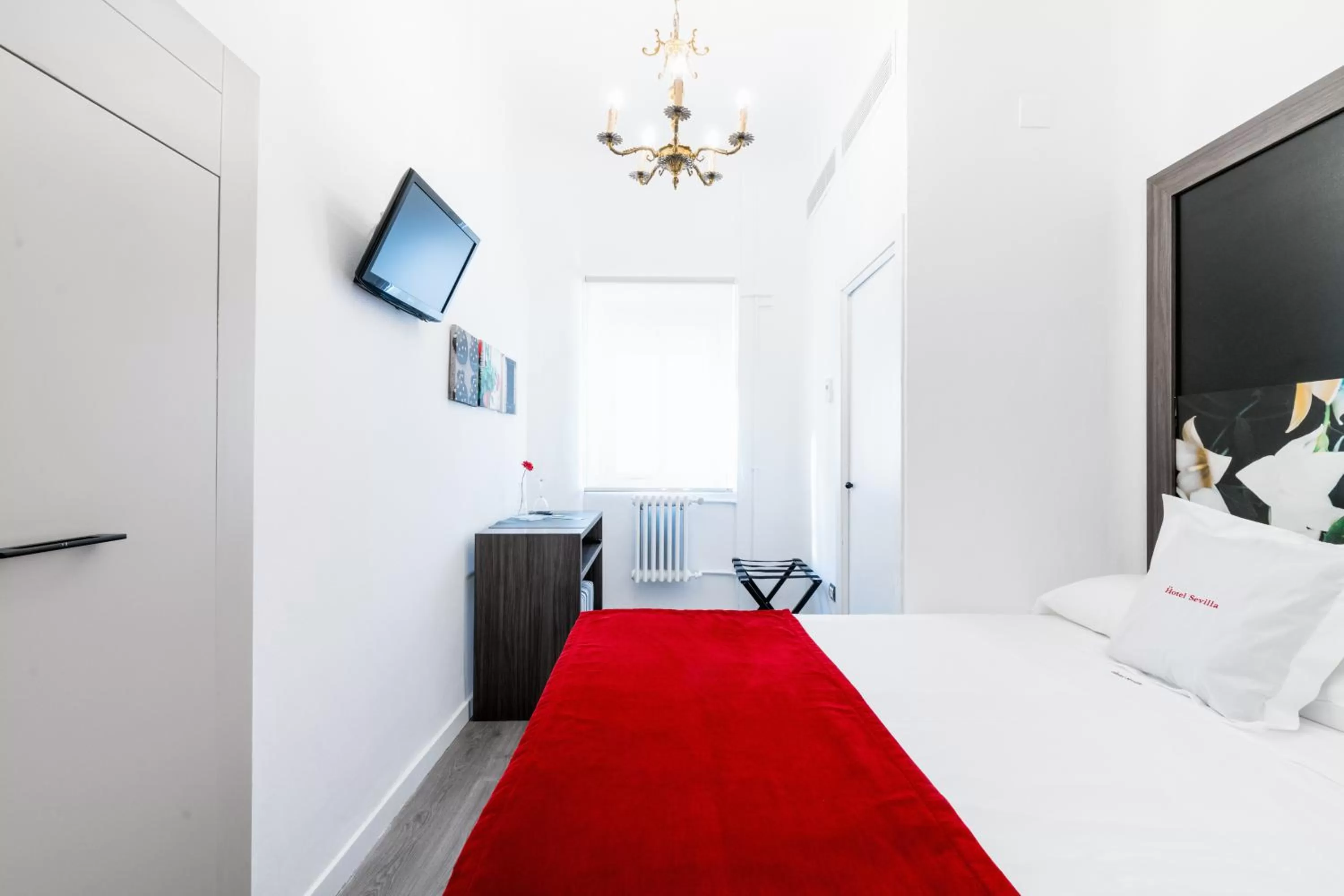 View (from property/room), Bed in Hotel Sevilla