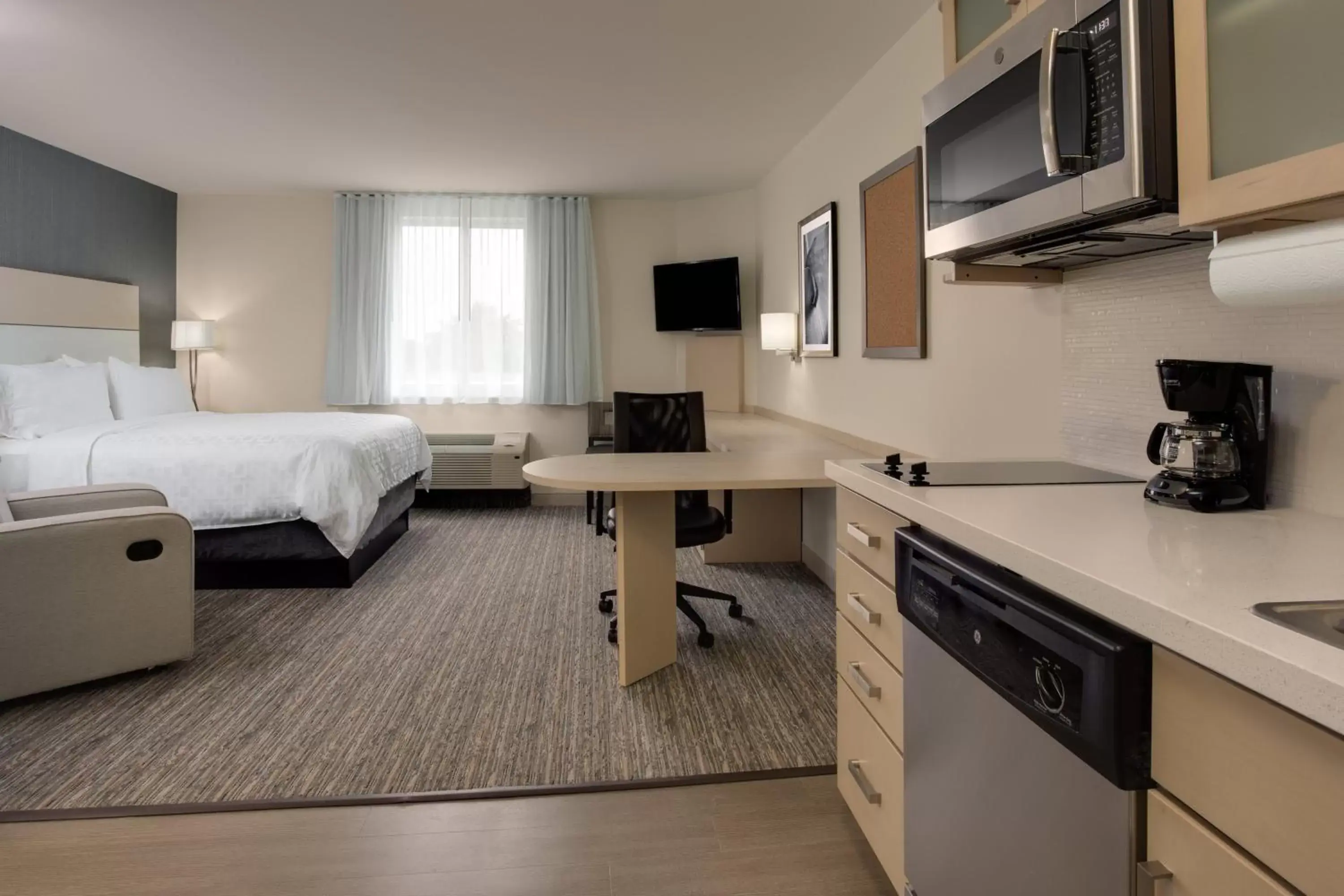 Photo of the whole room, Kitchen/Kitchenette in Candlewood Suites Miami Intl Airport - 36th St, an IHG Hotel