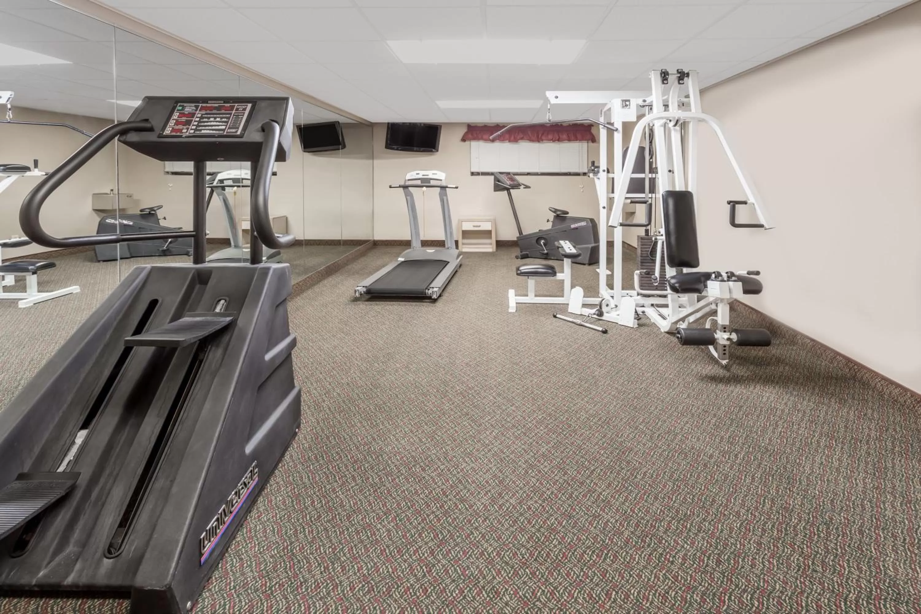 Fitness centre/facilities in AmericInn by Wyndham Janesville
